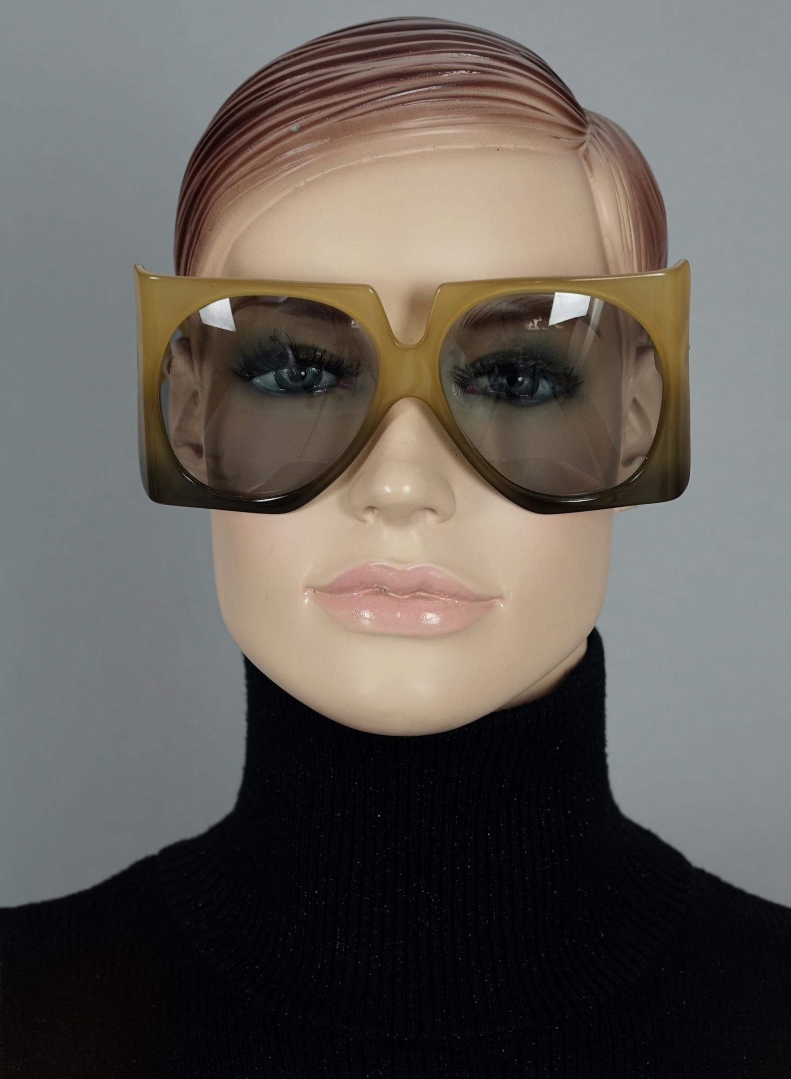 Vintage 1970s CHRISTIAN DIOR Oversized Square Space Age Sunglasses

Measurements:
Height: 2.75 inches (7 cm)
Horizontal Width: 5.98 inches (15.2 cm)
Temple Length: 4.13 inches (10.5 cm)

Features:
- 100% Authentic CHRISTIAN DIOR.
- Dramatic