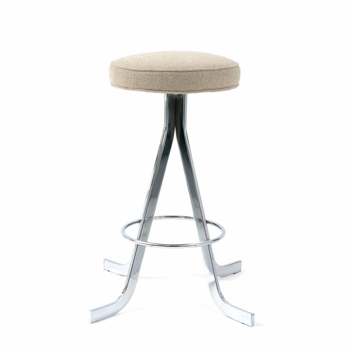Priced individually with up to four available are these vintage bar stools with chrome splayed leg base and round seats upholstered in Pierre Frey beige fabric, USA, circa 1970. 

Originally purchased from 1stdibs midcentury dealer John