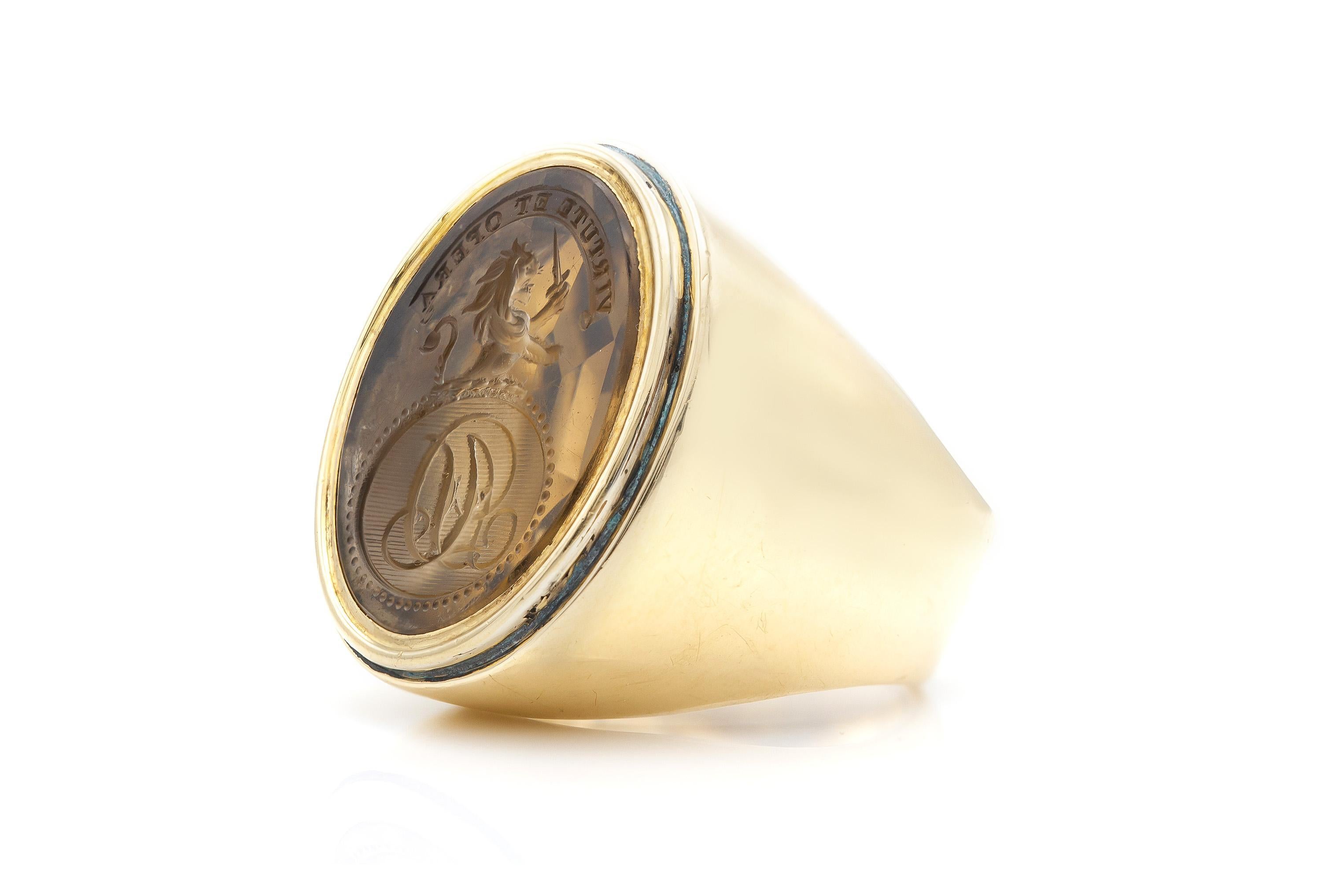 Finely crafted in 14k yellow gold with a Citrine intaglio featuring the phrase 
