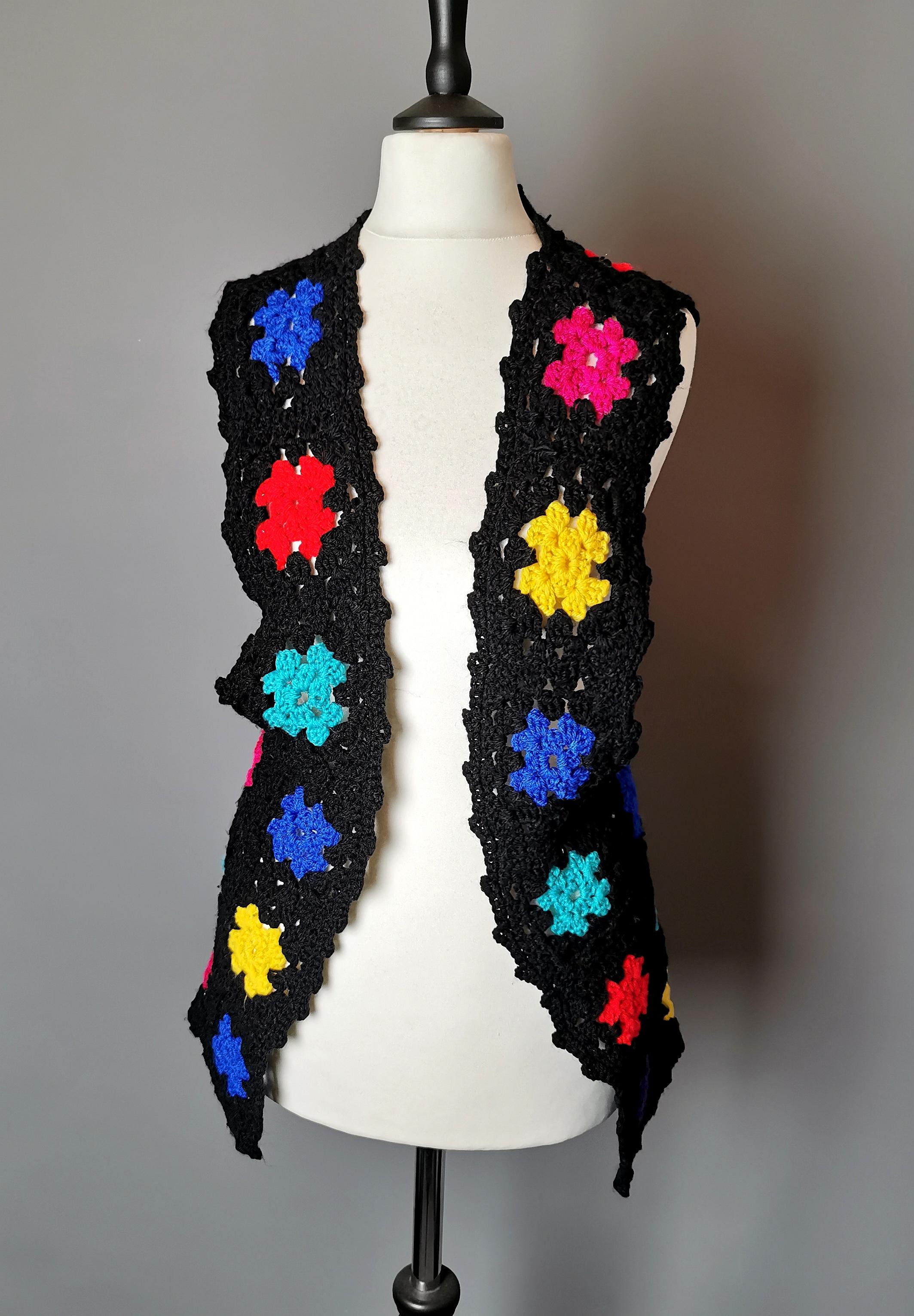 A rare vintage 1970s funky and colourful hand crocheted vest or waistcoat.

It is becoming increasingly tough to source original knitwear and these pieces are always in high demand, often hand made such as this piece, making the design truly one of