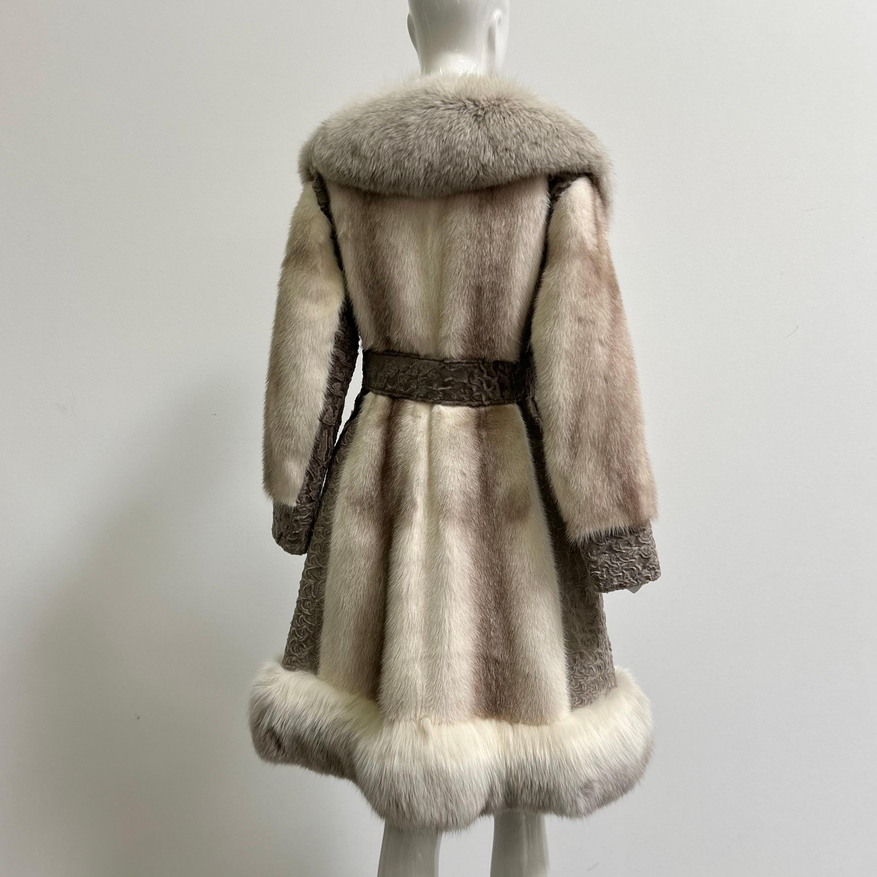 Fits a size medium. Stunning vintage 1970s cross mink, broadtail lamb and fox fur coat with matching belt. Fully lined. Monogram as shown. Hidden interior pockets. Outer pockets are cashmere lined. Excellent vintage condition with no damage. The