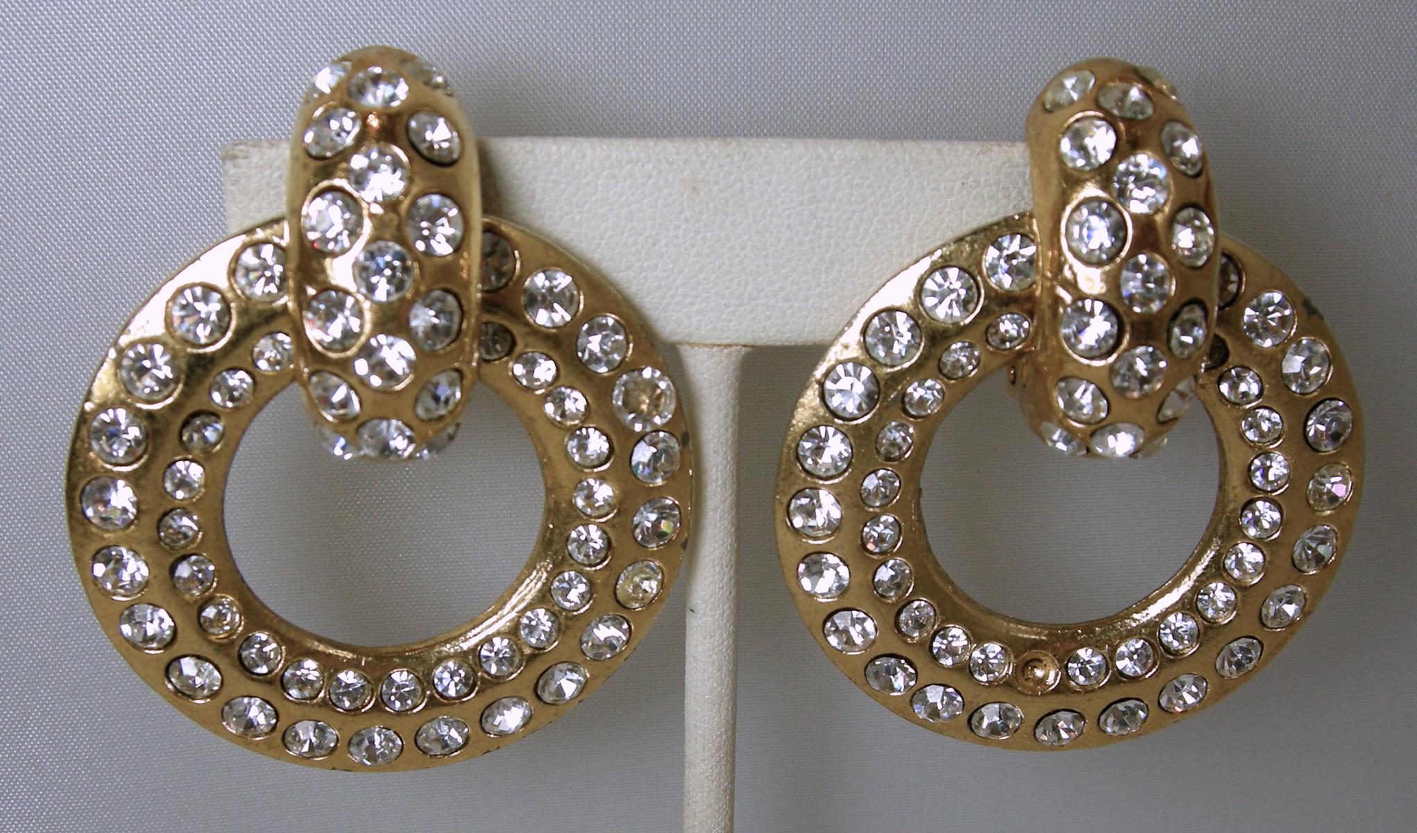 What I love about these vintage earrings are the options!  You can wear the top piece alone or with the drop hoop, so it’s actually two earrings in one!  They feature clear crystal accents in a gold tone setting.  In excellent condition, these clip