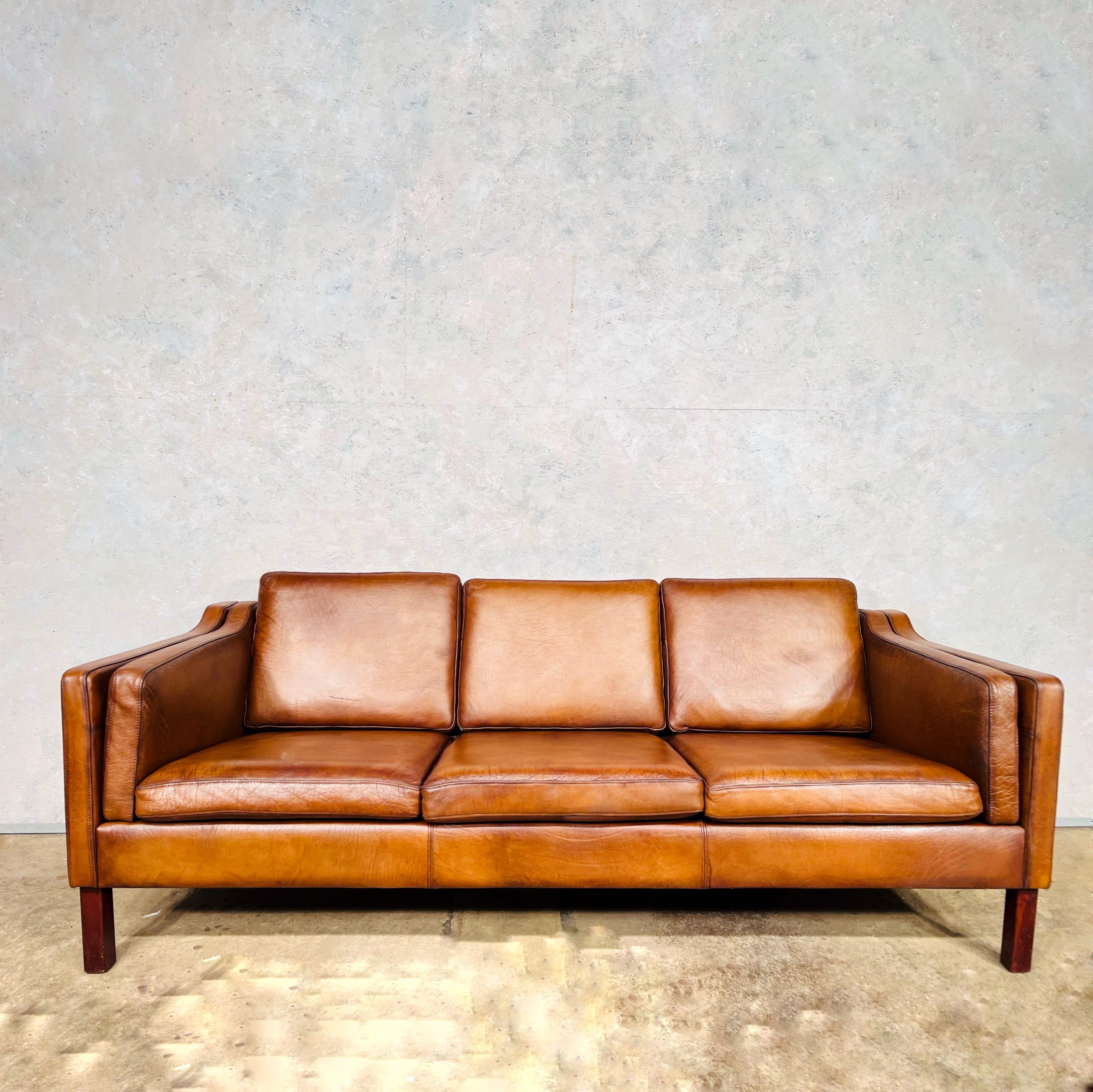 Vintage 1970s Danish vemb mobelfabrik 3 seater tan leather sofa.
Beautiful hand dyed leather and a beautiful tan colour with a great patina and finish.

In great condition.

Viewings welcome at our showroom in Lewes, East Sussex.


