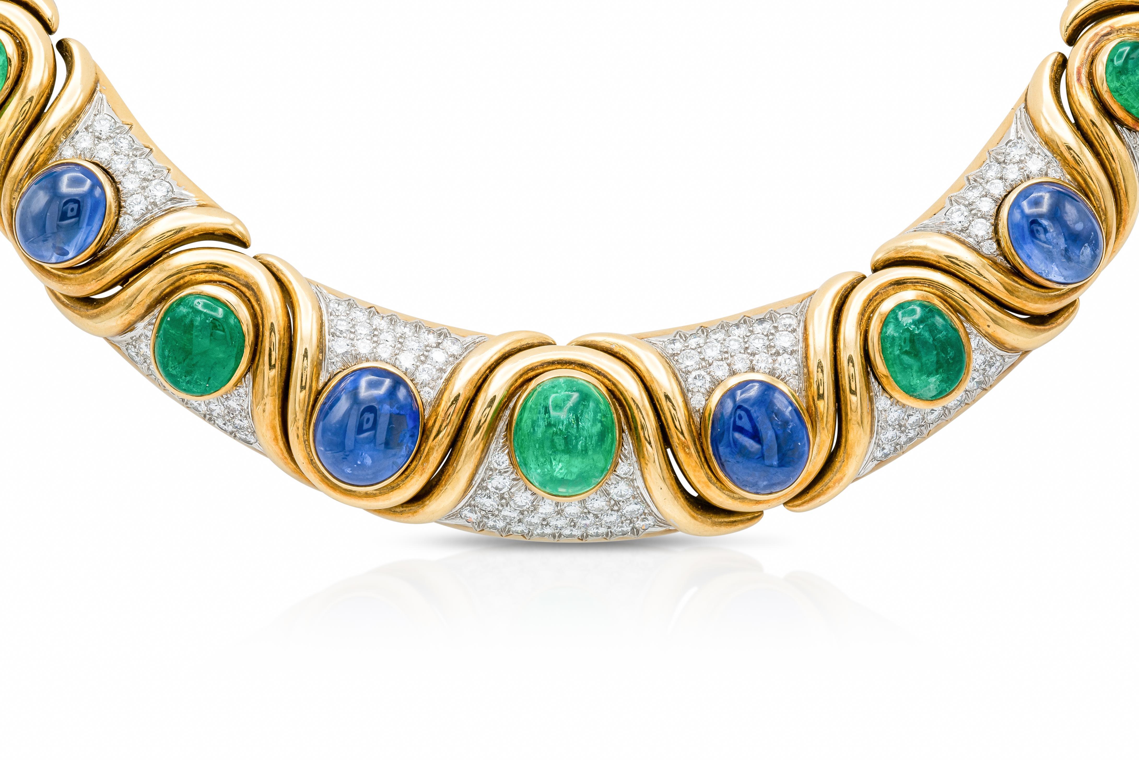 Finely crafted in 18k yellow gold and platinum with Cabochon Emeralds weighing a total of 32.11 carats, Cabochon Sapphires weighing a total of 35.73 carats, and Round Brilliant cut Diamonds weighing a total of approximately 12.00 carats.
Signed by