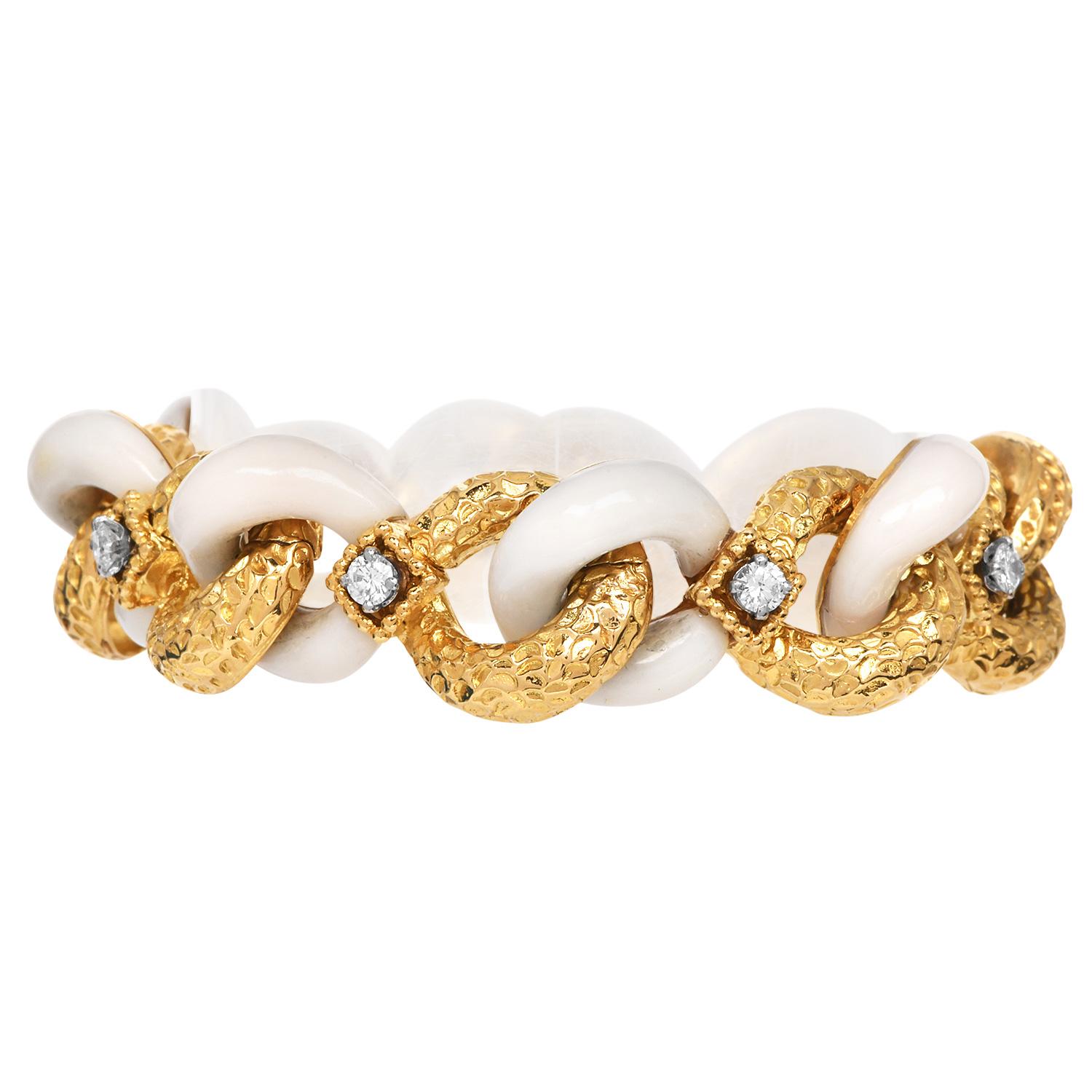 1970s statement piece, this bracelet combines hammered-texture 18K yellow gold and carved Bone  for a striking contrast. Accented with eight prong-set brilliant-cut diamonds totaling approximately 1.00 carat (G–H color, SI clarity), a chain-link