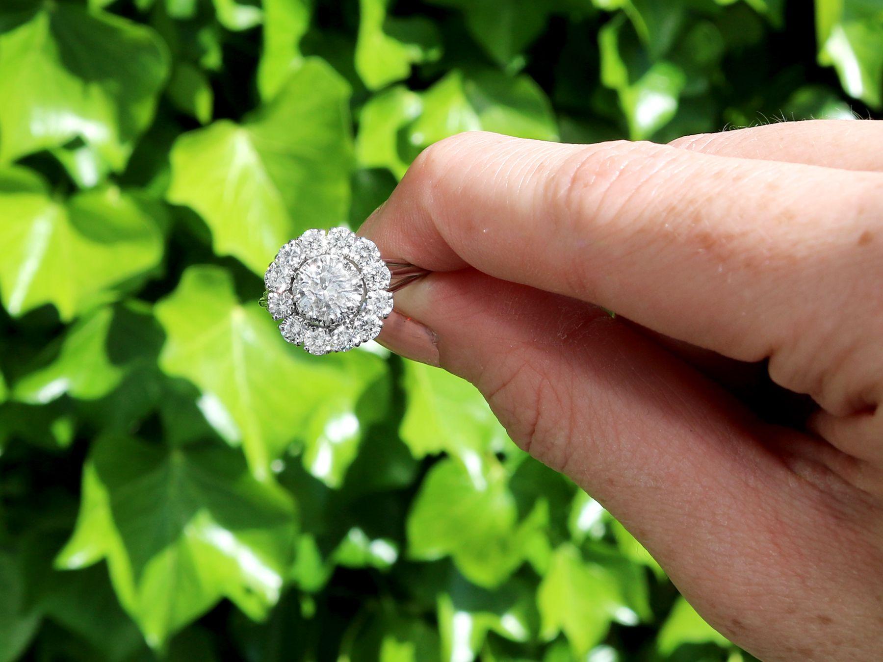 A stunning, fine and impressive 1.66 carat diamond and 18 karat white gold, platinum set cluster ring; part of our diverse diamond jewellery and estate jewelry collections.

This stunning, fine and impressive vintage diamond ring has been crafted in