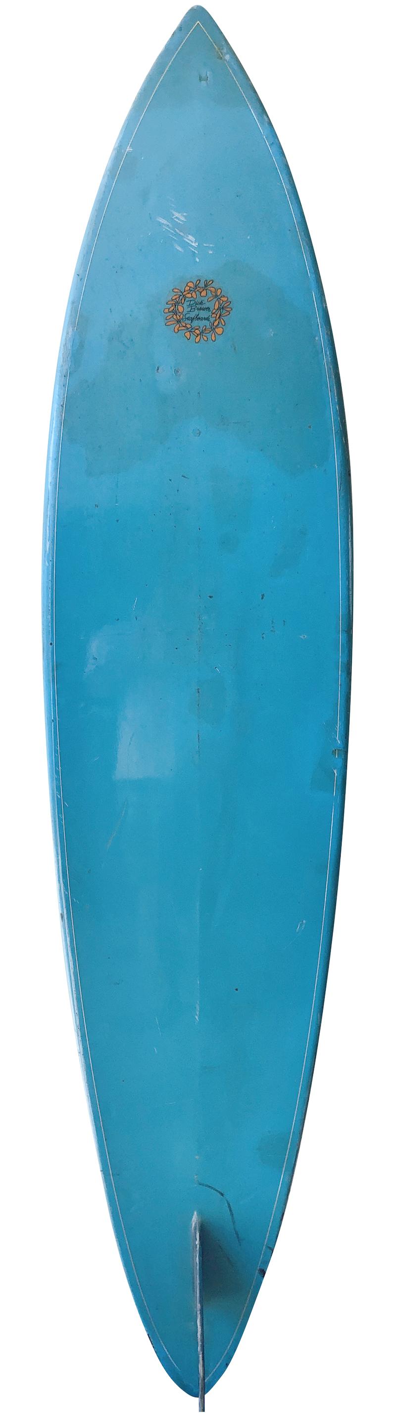 Mid to late 1970s Dick Brewer surfboards single fin shaped by Joe Blair. Features a rounded pintail with beautiful blue tint, double pin-line design, and glassed on single fin. This vintage surfboard remains in all original condition.

Dick Brewer