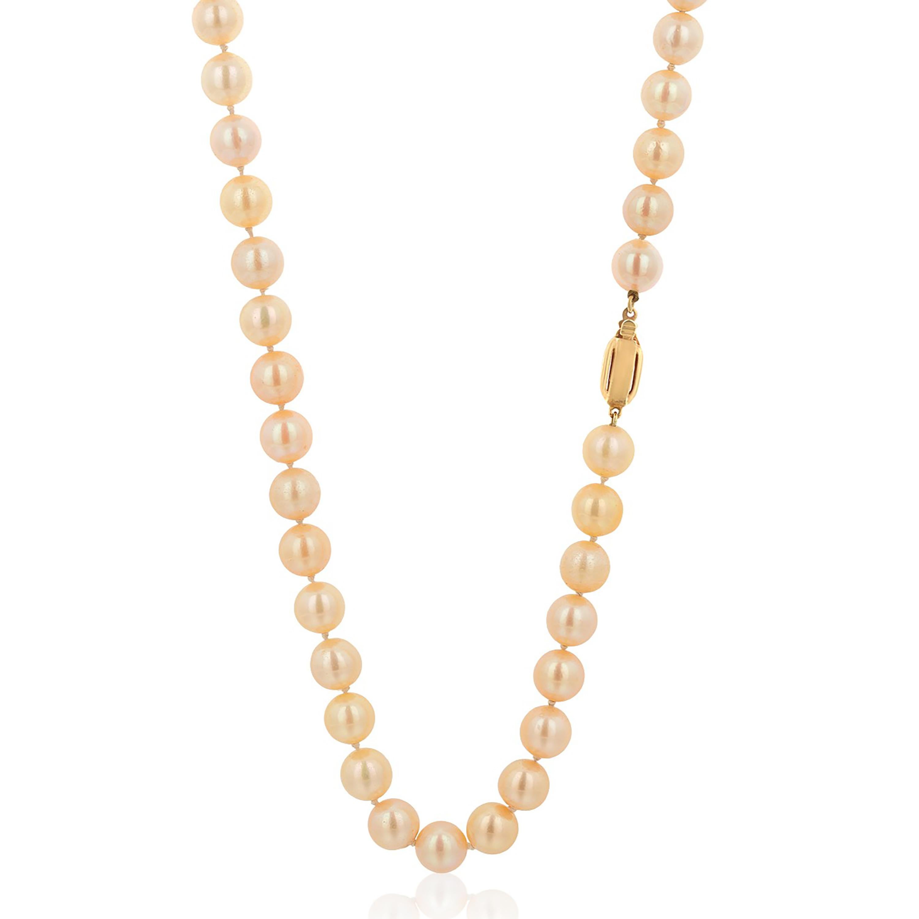 Vintage 1970s Double Strand Cultured Pearl 30 inch Long 14k Gold Clasp Necklace In Good Condition For Sale In New York, NY