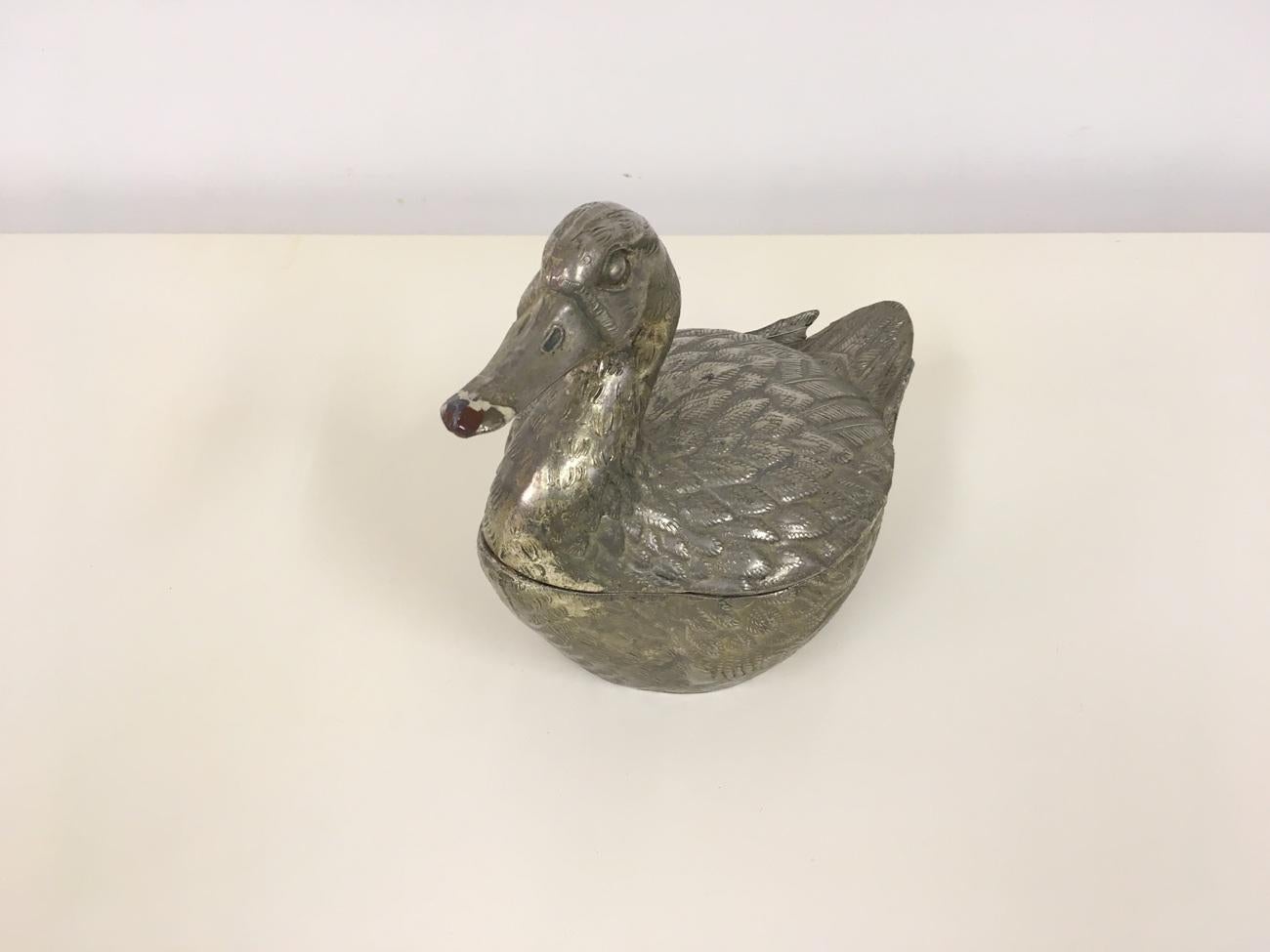 Duck ice bucket 
By Mauro Manetti
Silvered metal
Italy 1970s
This one with some wear to the nose/beak.