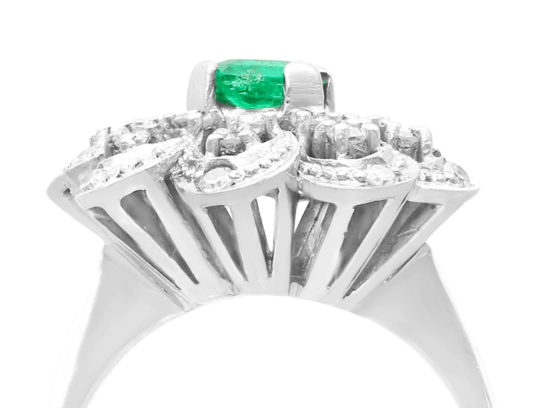 A fine and impressive 0.73 carat emerald and 0.70 carat diamond, 10 karat white gold dress ring; part of our diverse antique jewelry and estate jewelry collections.

This fine and impressive emerald and diamond ring has been crafted in 10k white