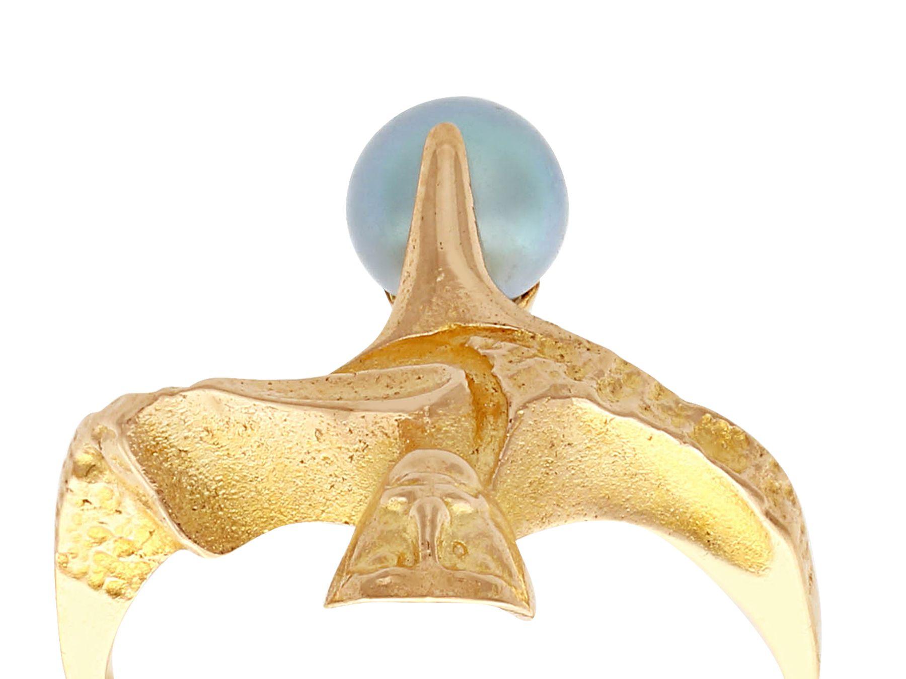 An impressive vintage Finnish cultured pearl and 14 karat yellow gold dress ring by Lapponia; part diverse vintage jewelry and estate jewelry collections.

This fine and impressive Lapponia ring has been crafted in 14k yellow gold.

The organic,