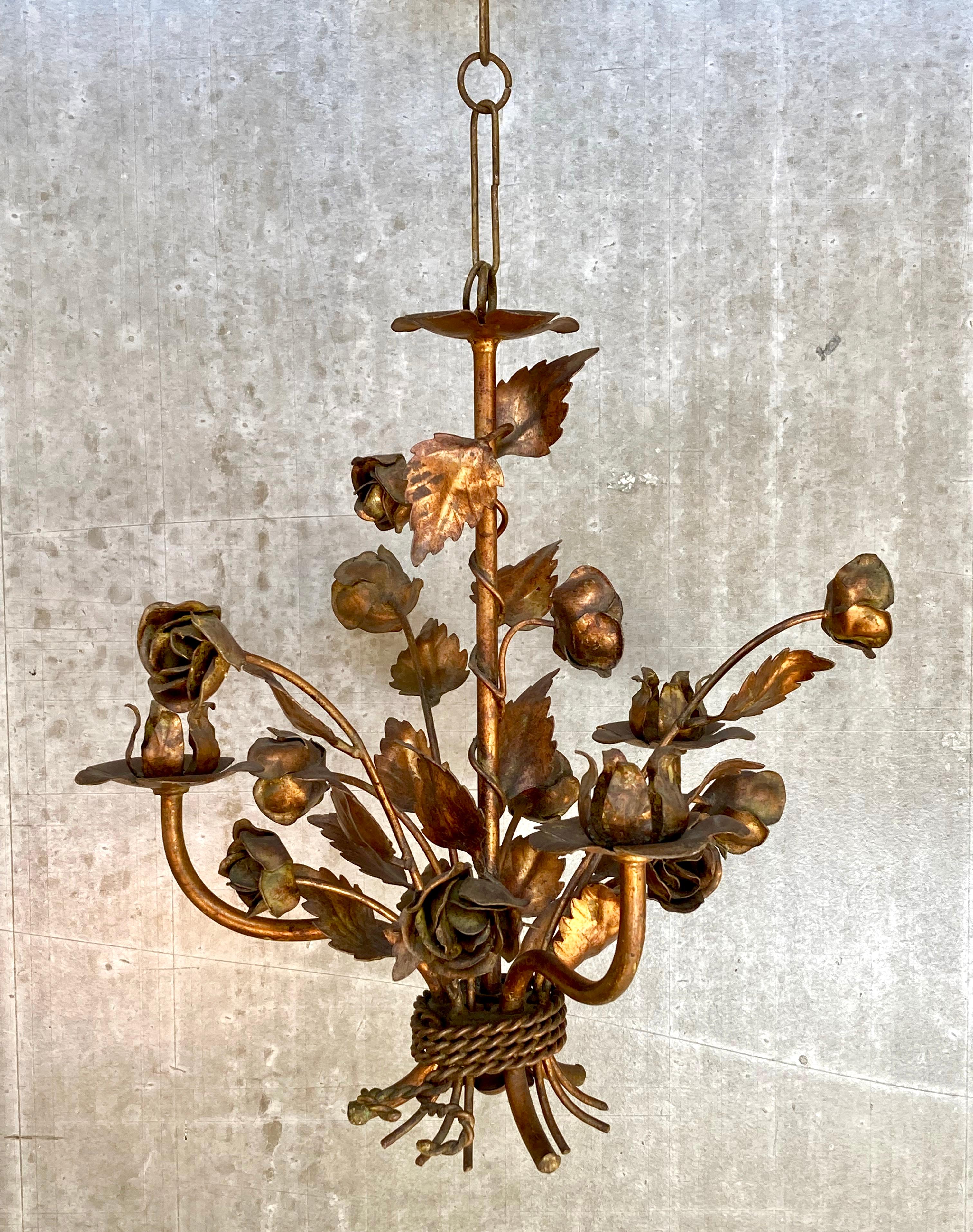 A beautiful chandelier from the 1970s by German designer Hans Kögl. This is a small model, designed with three arms (candles or light bulbs), perfect for smaller spaces. The chandelier has a wonderful floral design with 10 roses and a multitude of