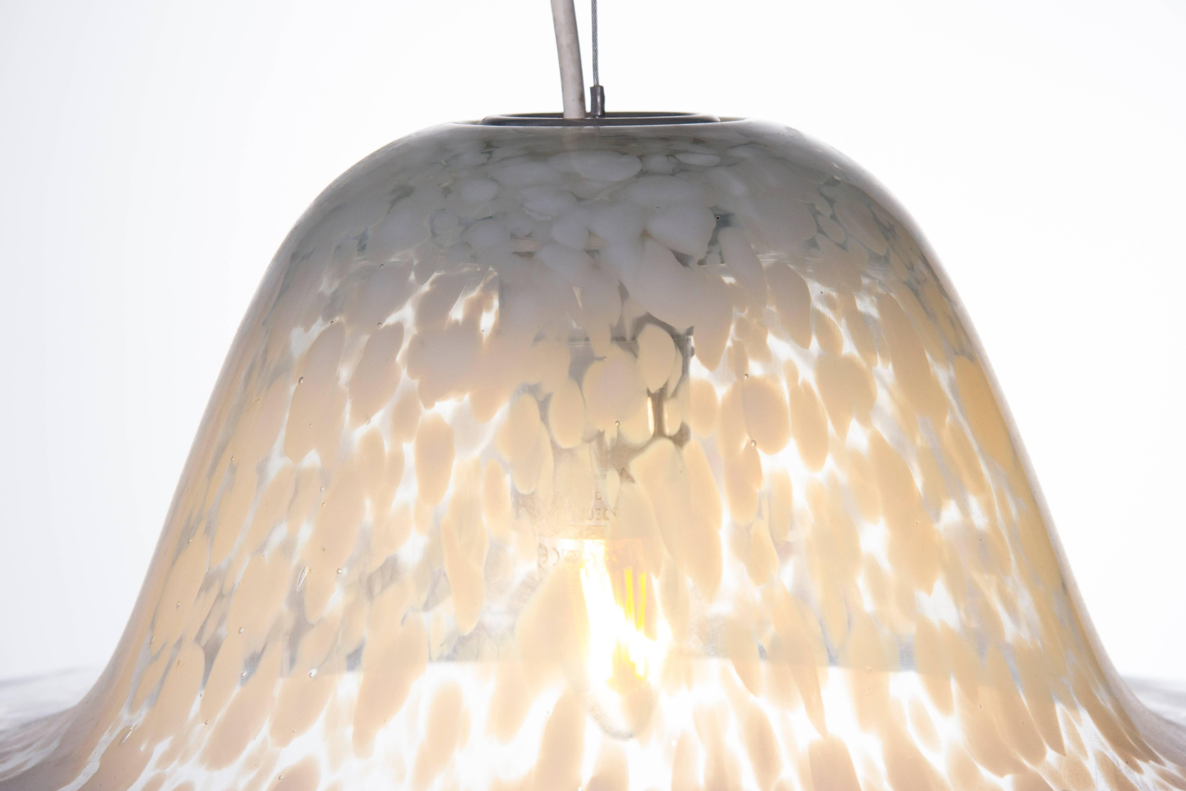 Vintage 1970s German mottled glass hanging light in the shape of a flying saucer designed by Aloys Ferdinand Gangkofner for Peill & Putzler. The height can be adjusted according to your exact requirements making it a perfect addition for a dining