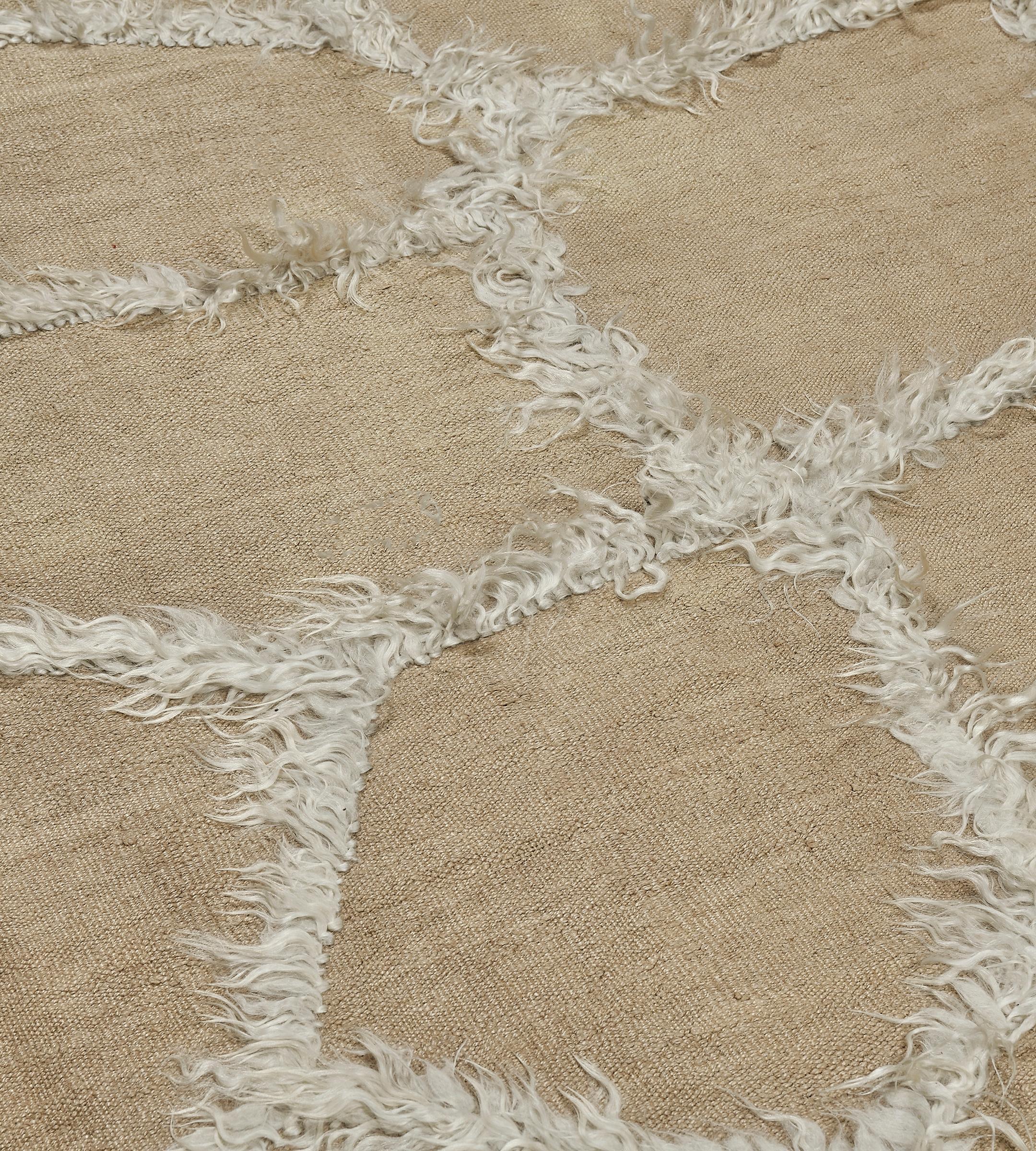 This playful, tactile Turkish rug from the mid-20th century creates a fun, contrasting texture that will enliven a room. The vintage design has a camel-colored hemp field with an overall pattern of irregular polygons formed by long natural mohair.