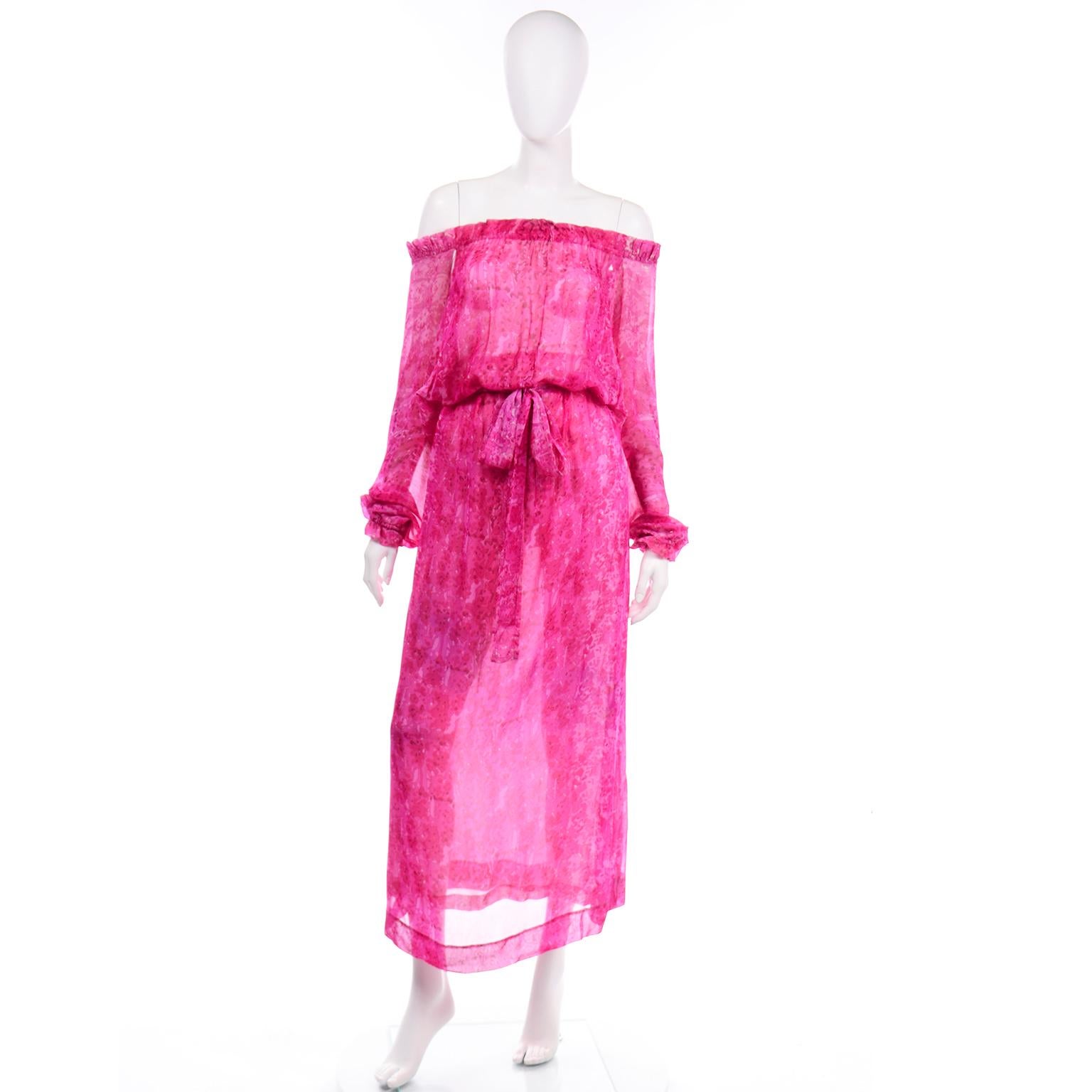 This rare 1970's Givenchy vintage pink print tissue silk dress is truly stunning! The dress has a high neck (or it can be worn off the shoulders as shown), and the back is completely open to the waist with a beautiful ruffled trim. This ethereal