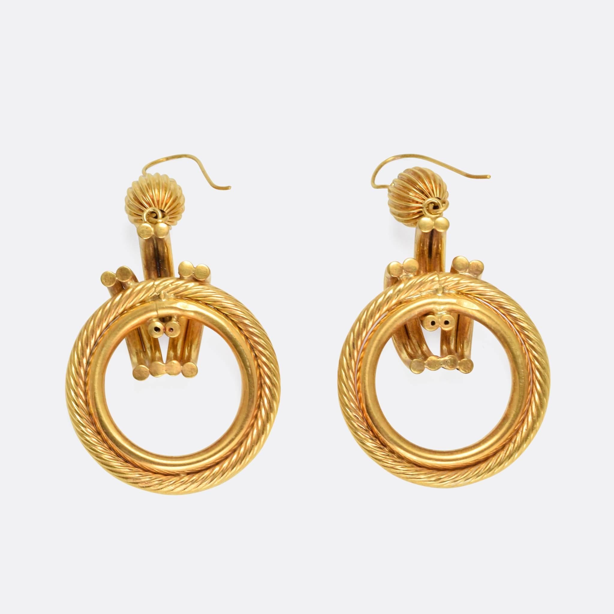 A pair of vintage, larger scale gold earrings modelled in yellow gold throughout. They date to the 1970s, still looking fabulous today.

MEASUREMENTS
Drop: 6.2cm
Width: 3.2cm

WEIGHT
10.8g

MARKS
No marks present, tests as 9k gold