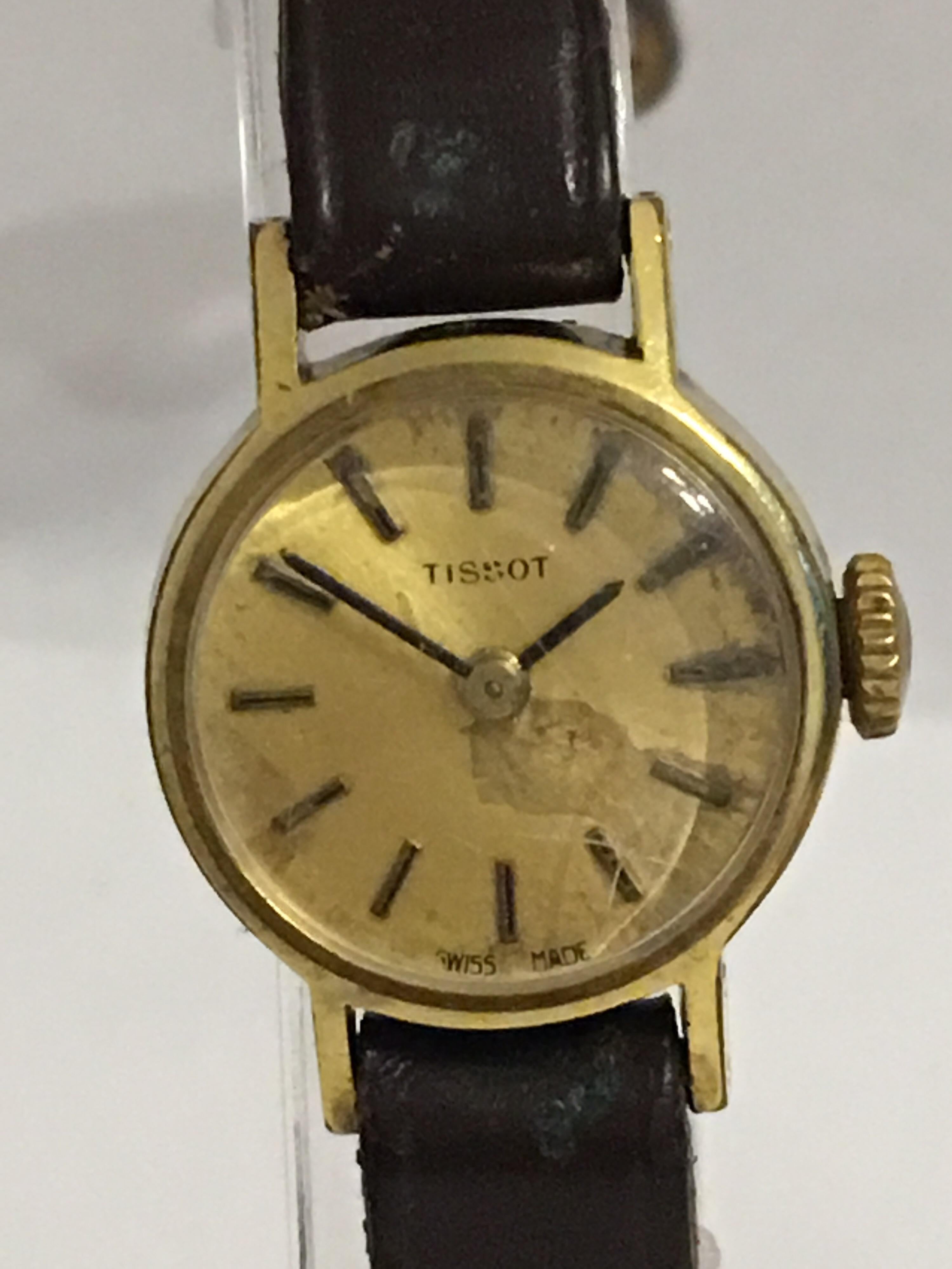 This beautiful Tiny mechanical vintage watch is working and ticking well. Visible tarnished marks on the gold plated Dial, the strap is worn and damaged visible few scratches on the top glass. Please  study the images carefully as form part of the