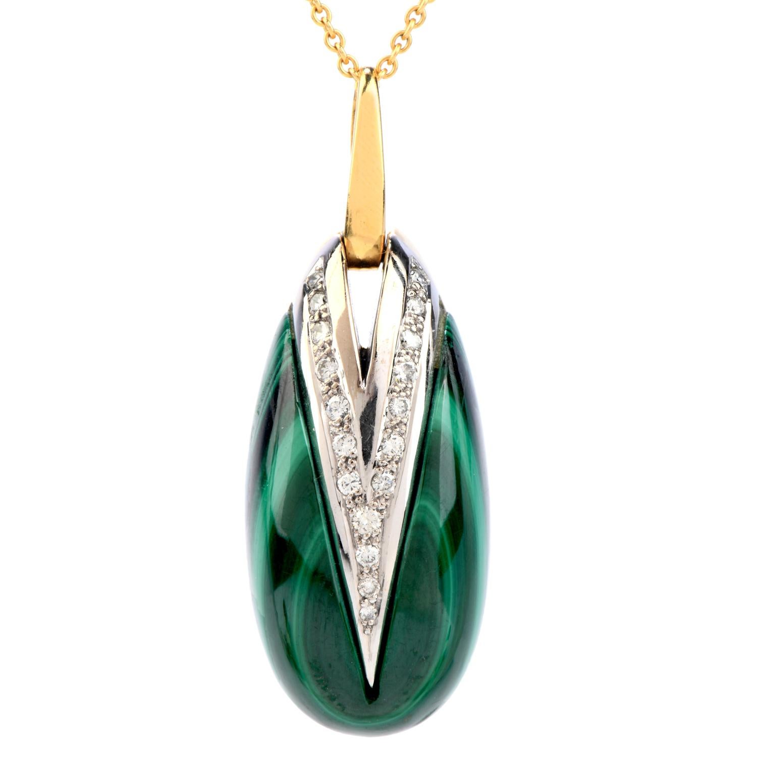 This Vintage 1970's pendant crafted with solid 18-karat yellow gold, weighing 34.2 grams and measuring 52mm long (including bale) x 19mm wide (max).

Composed of a rounded oval green genuine malachite stone l framed in  detailed yellow gold.

Set