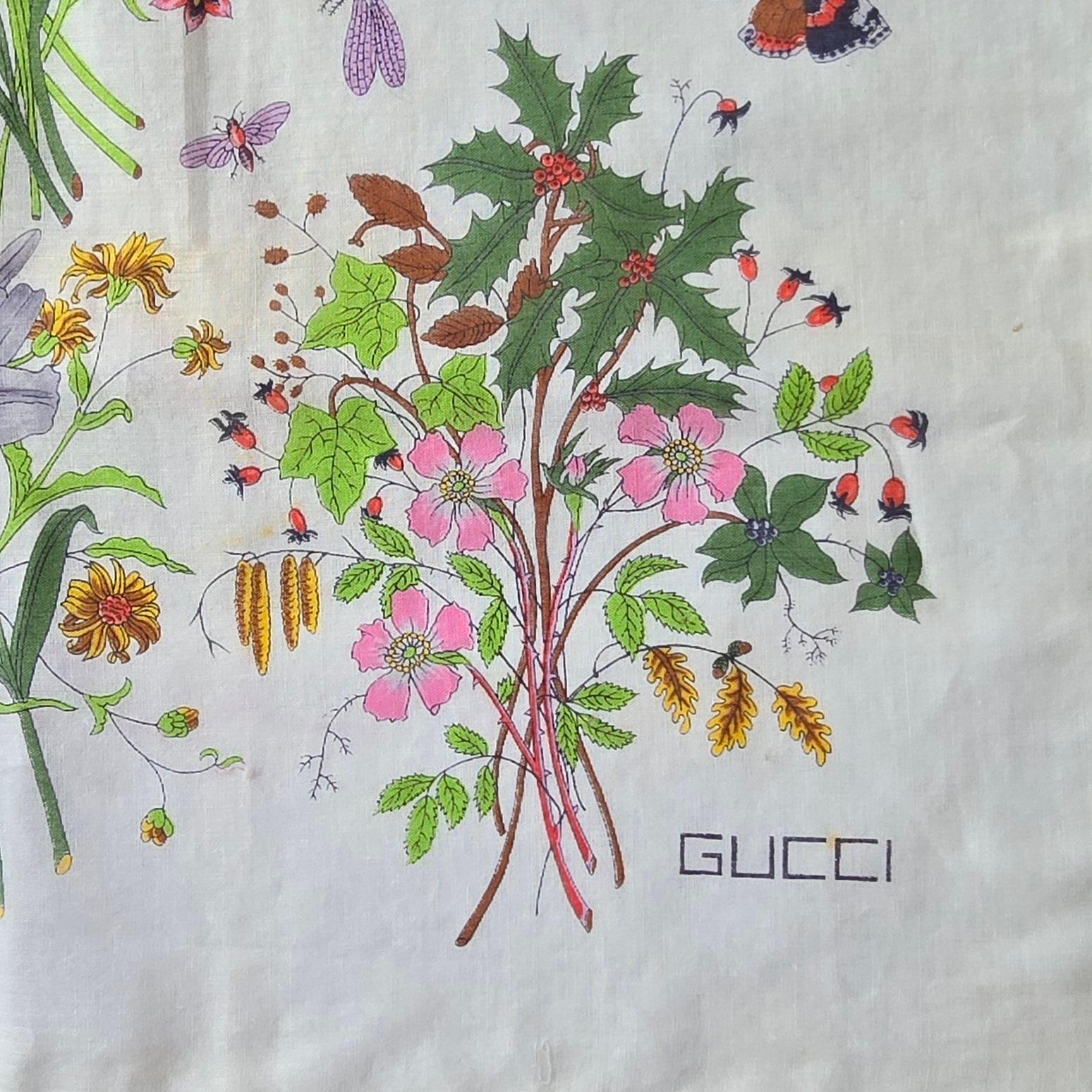 This exquisite Gucci scarf, a true vintage treasure, remains in  unused condition, having been carefully preserved in its original packaging since the 1970s. It is a remarkable piece from my family's personal collection, now available for a