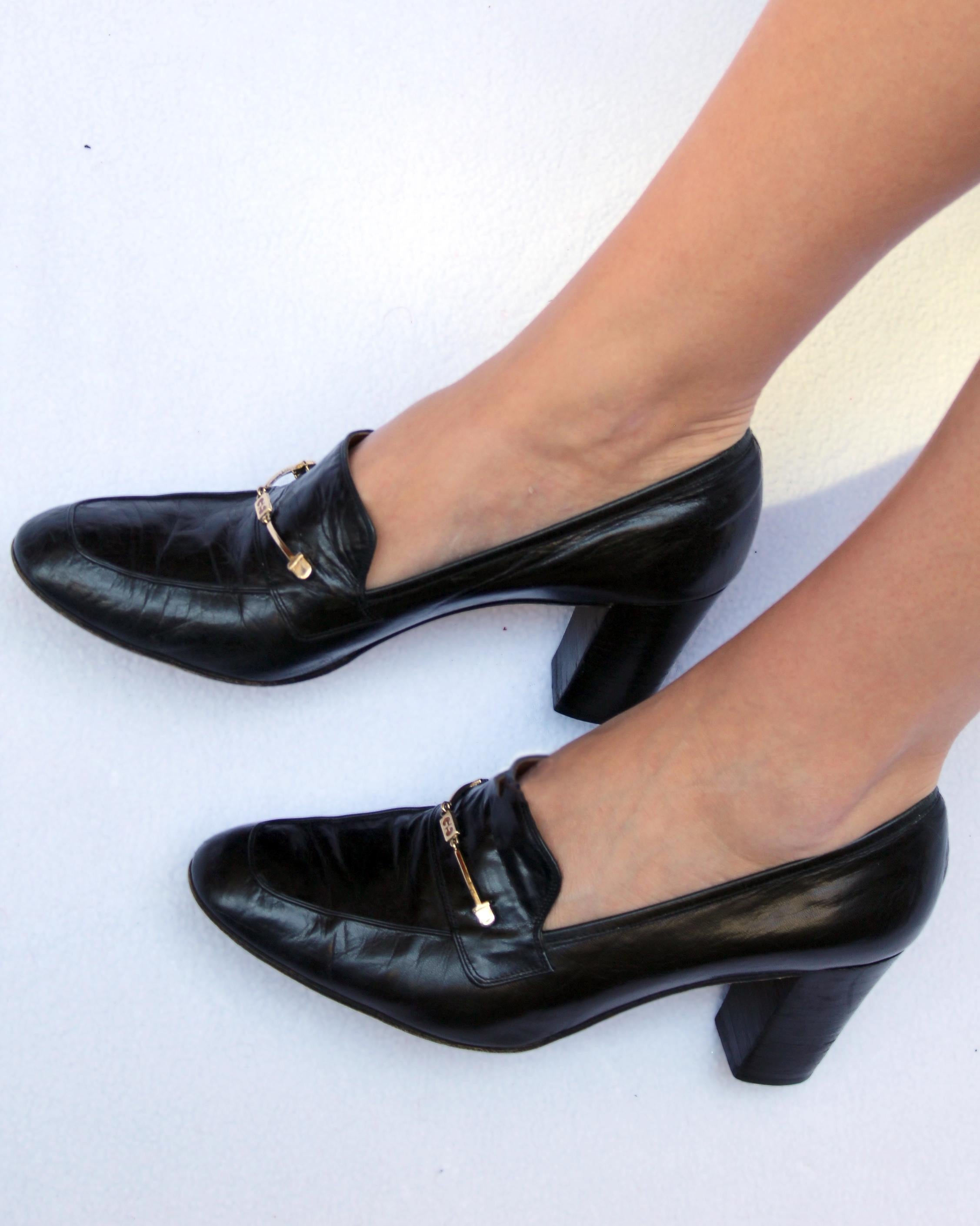 These iconic vintage 1970s Gucci heeled loafers are so timeless, featuring the classic Gucci horsebit detail debossed with the GG logo. They are a soft black color, crafted in Italy of the most butter-soft leather— they've been broken in for you, so