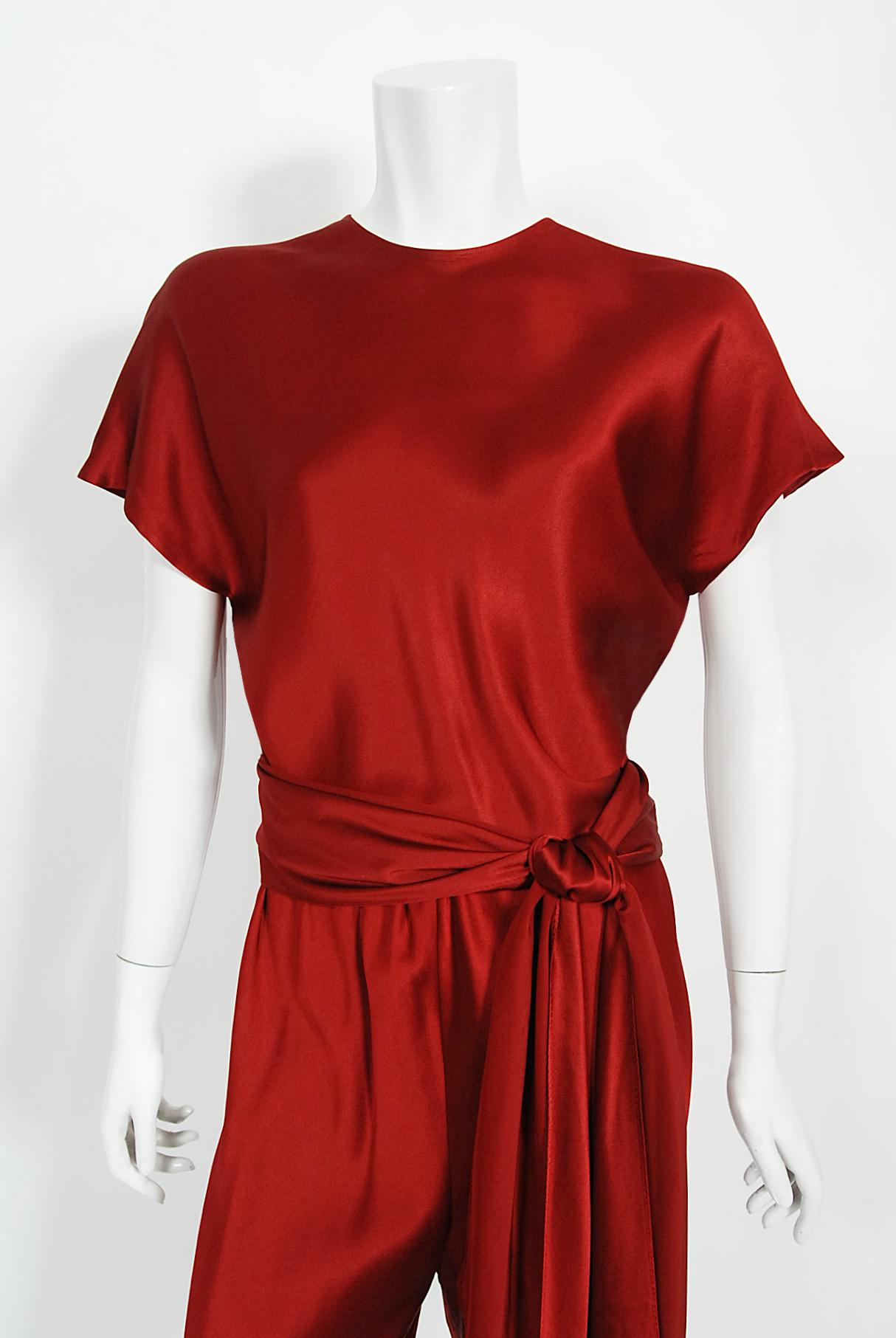 An absolutely gorgeous Halston couture wine red silk three-piece ensemble dating back to his fall-winter 1979 collection. As shown, the same set in mustard is archived at the Metropolitan Museum of Art in New York. Halston revolutionized the way