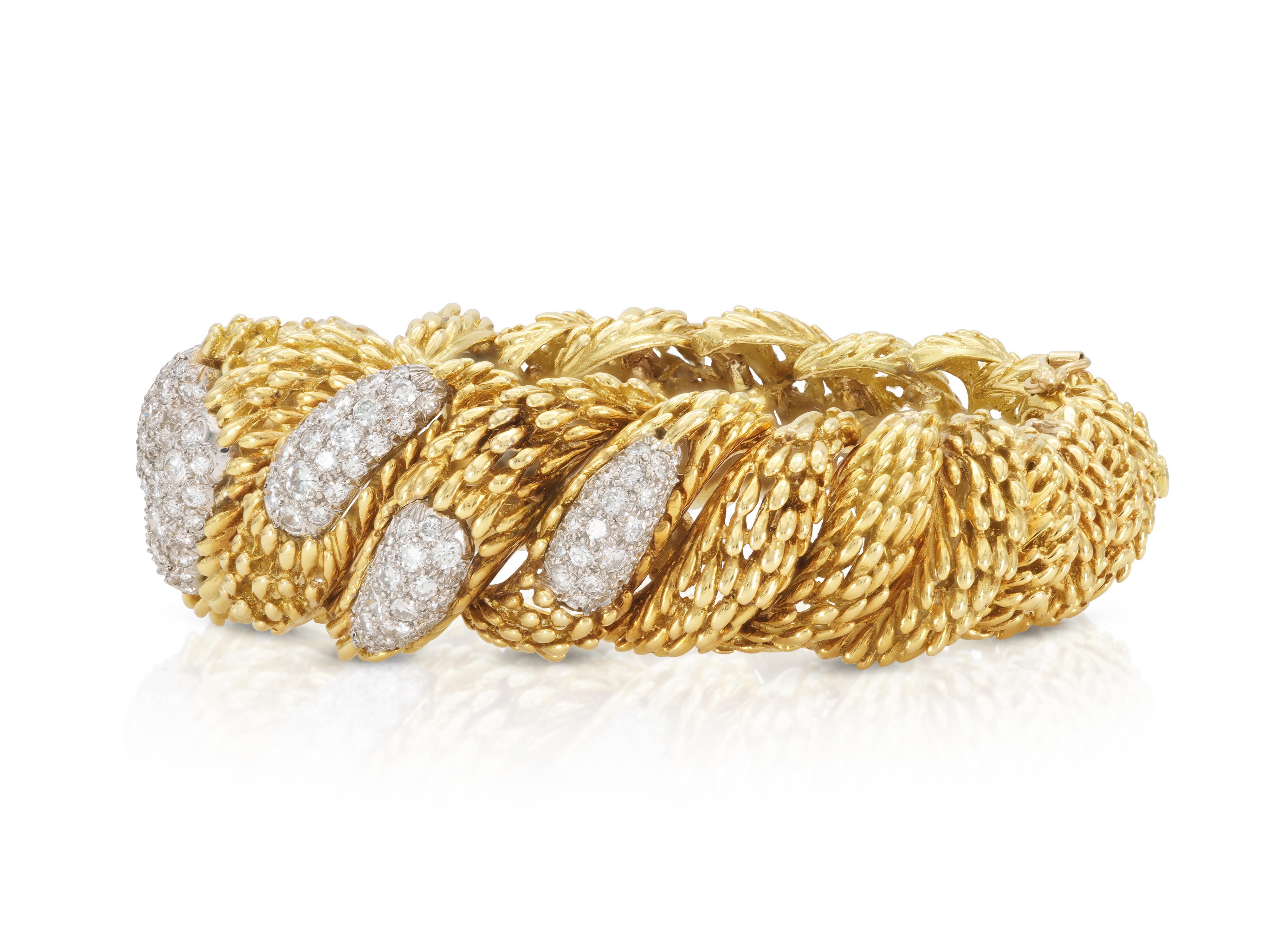 Finely crafted in 18k yellow gold with Round brilliant cut Diamonds weighing approximately a total of 11.00 carats.
Signed by Hammerman Brothers
Circa 1970s
Size 6 3/4 inches