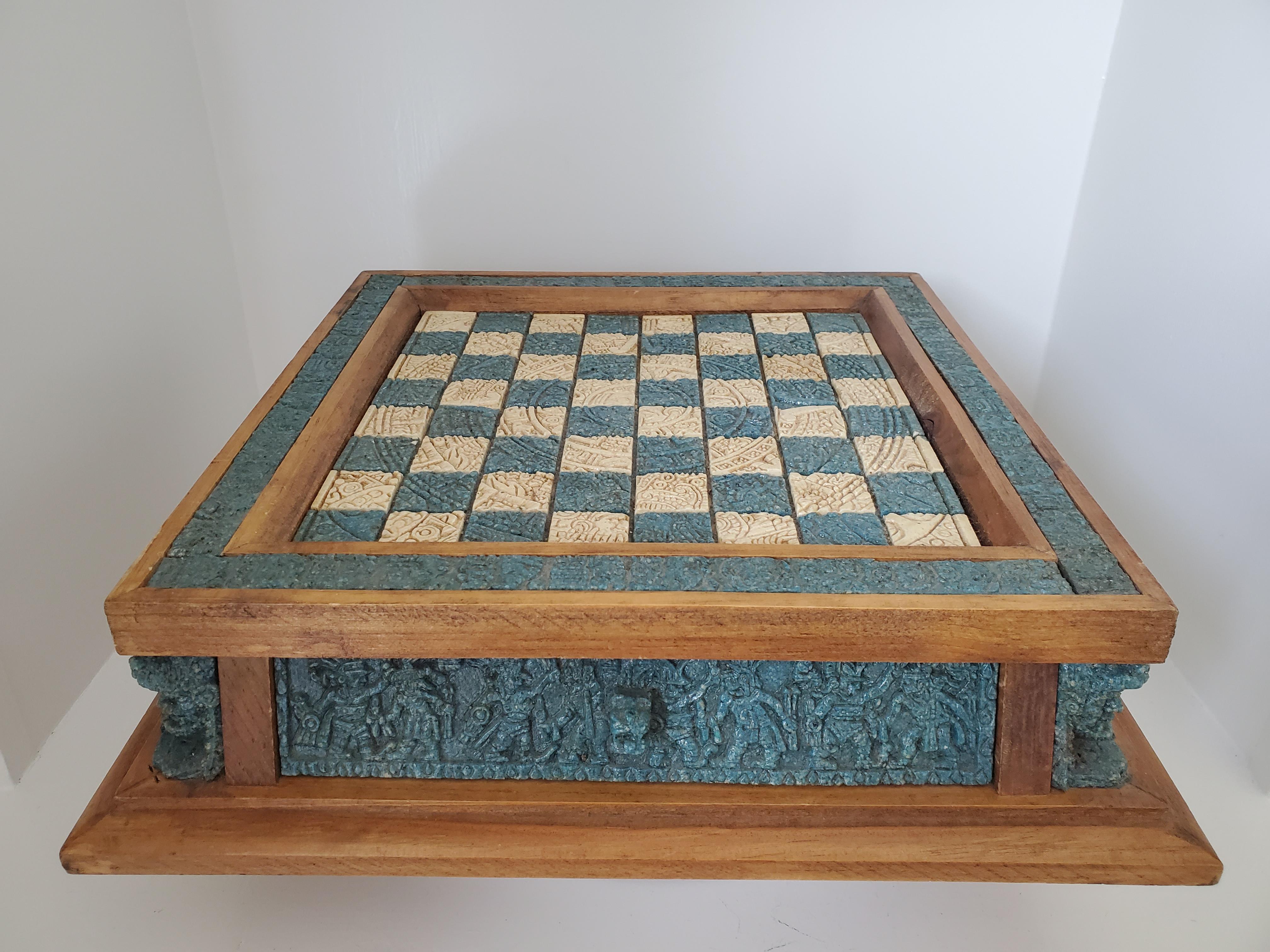 This amazing vintage chess set is complete with dark blue green and beige pieces cast in resin and crushed stone from hand carved molds. The pieces are depictions of Aztec warriors of the 16th century defending their territory against Spanish