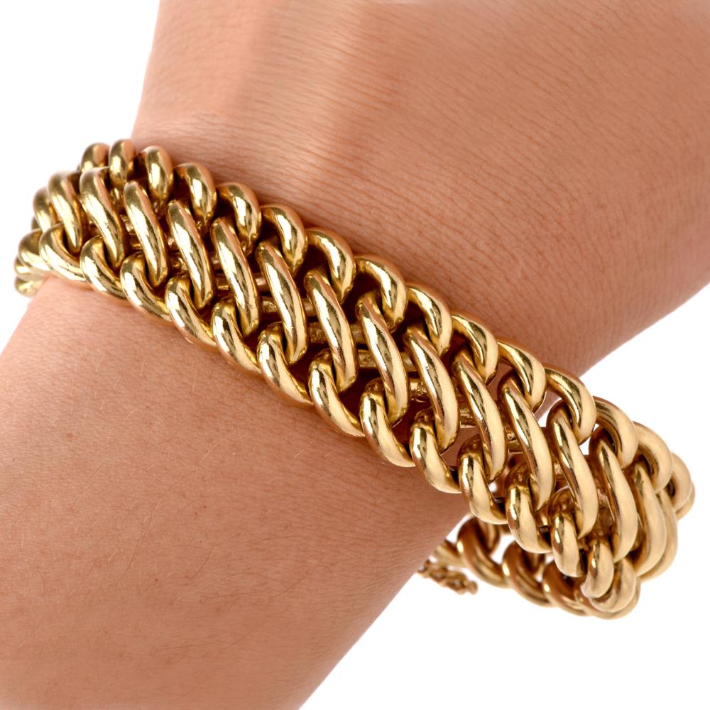 This authentic and heavy 1970s bracelet is crafted in solid 18 karat yellow gold, weighs 137.9 grams and measures 7 ¼ inches and 19 mm wide. A retro wrist adornment of opulent aesthetic, the bracelet incorporates interlocking oval links in diagonal