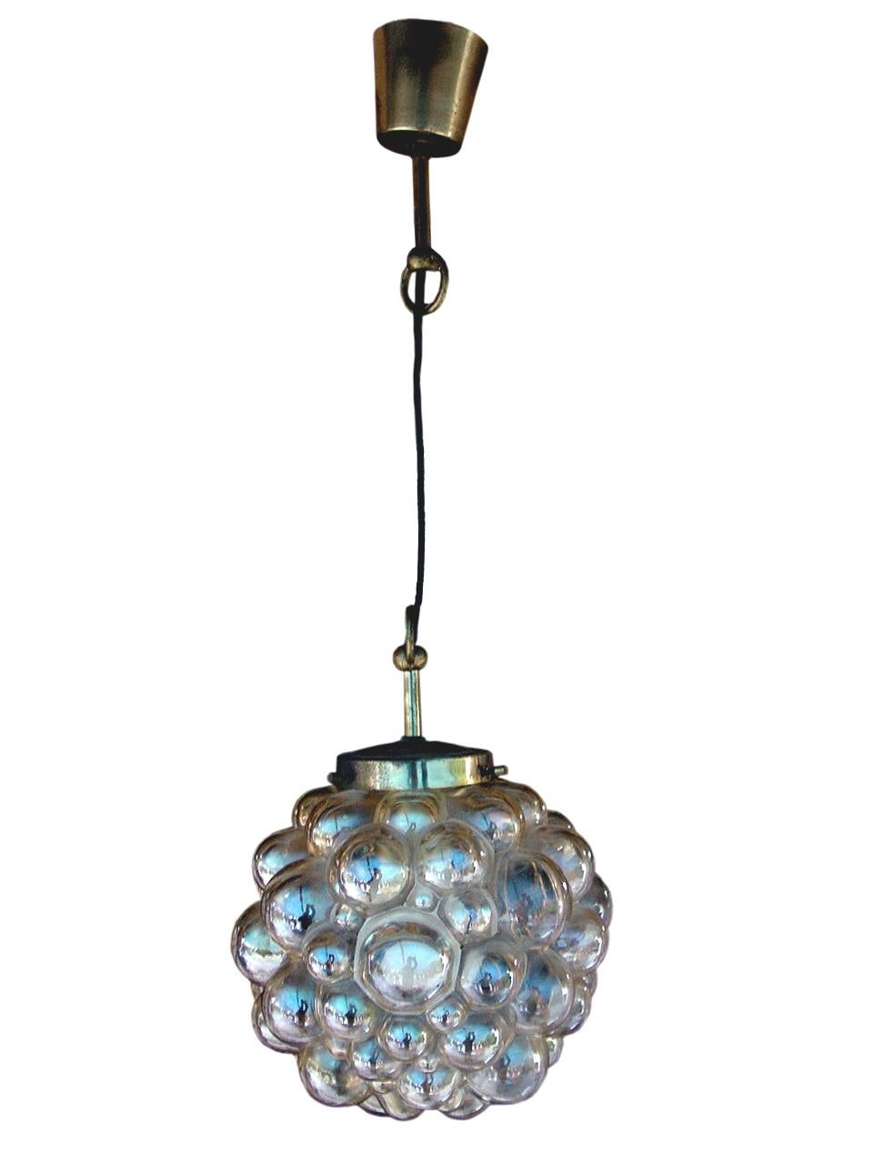 Designed by Helena Tynell and Heinrich Gantenbrink for Glashüttenwerke Limburg, Germany.

 ceiling lamp amber bubble with structure in brass, years ’50 orignal in every particular, in perfect condition