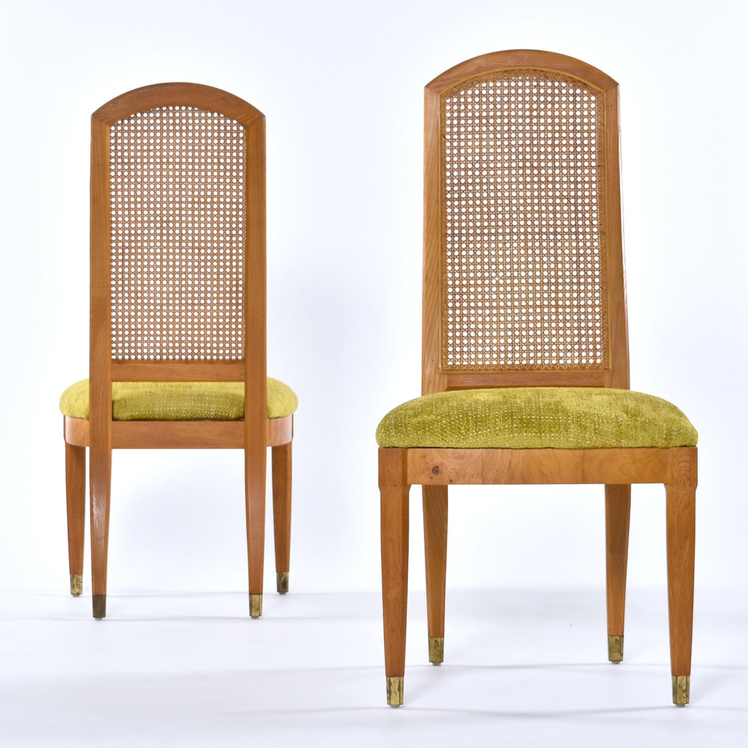 Handsome set of four Henredon burl wood dining chairs with caned backs. The vintage 1970s dining chairs are ash wood with ash burl accent along the seat trim. The chair seats have been restored with new chartreuse green upholstery and decking. The
