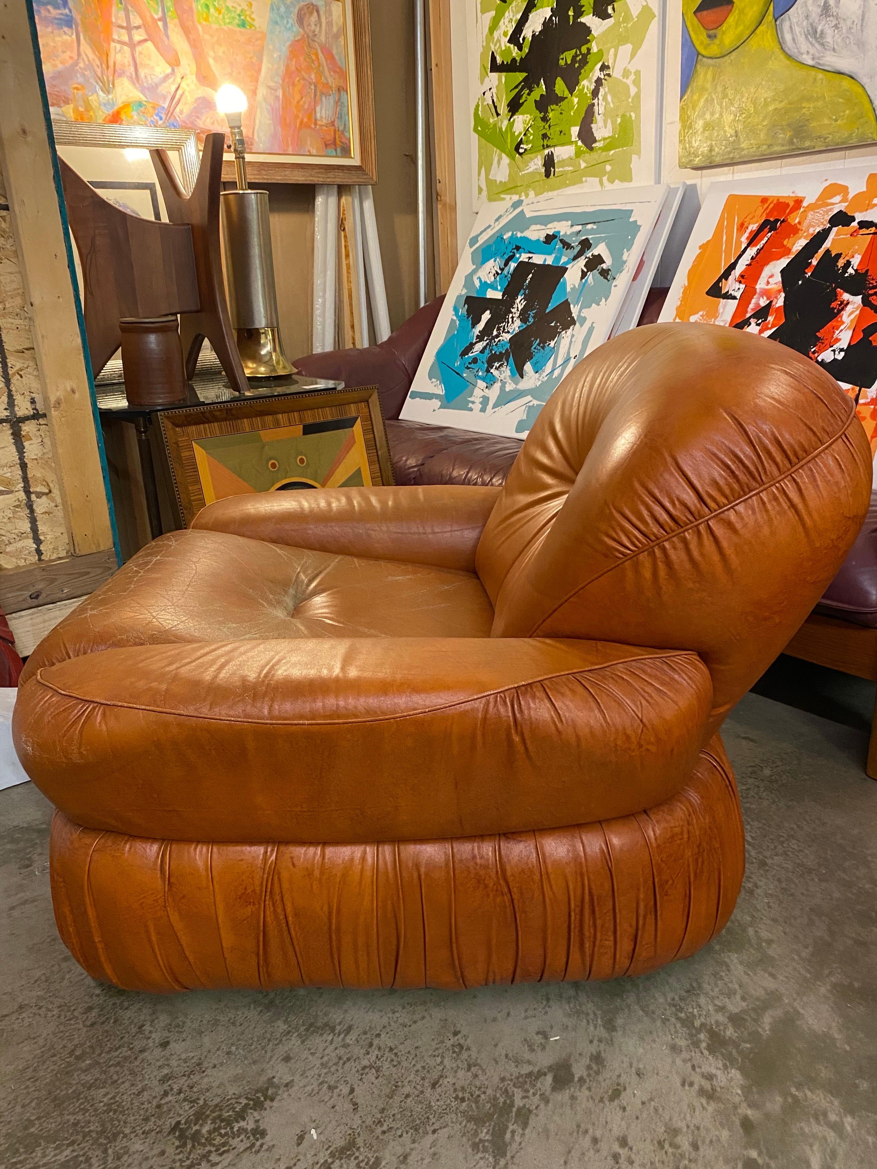 Vintage Italian leather chair, 1970s in a beautiful burnt orange color features a nice patina and is in great overall condition. Maker is unknown.