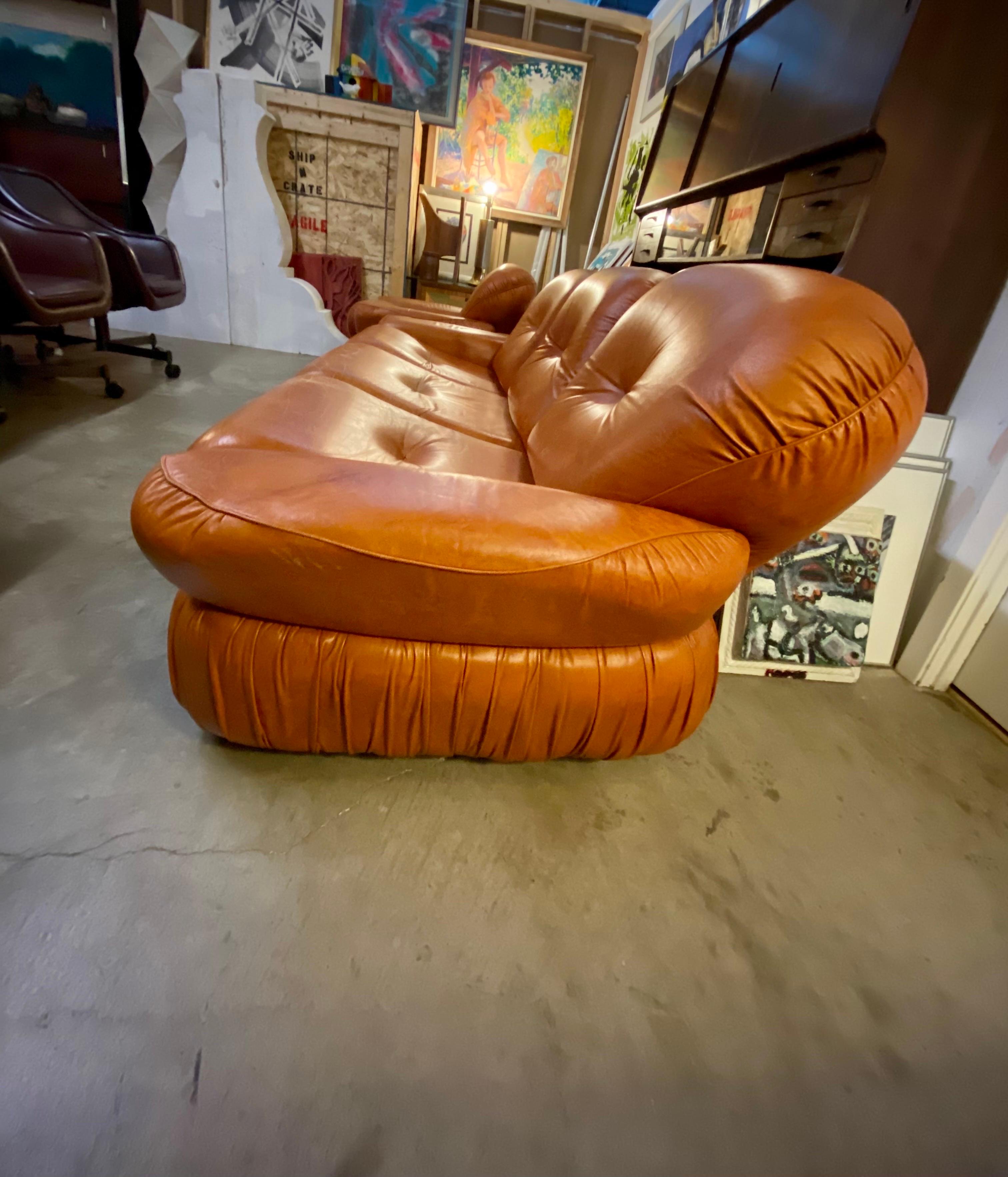 Vintage Italian three-seater leather sofa, 1970s in a beautiful burnt orange color features a nice patina and is in great overall condition. Maker is unknown.