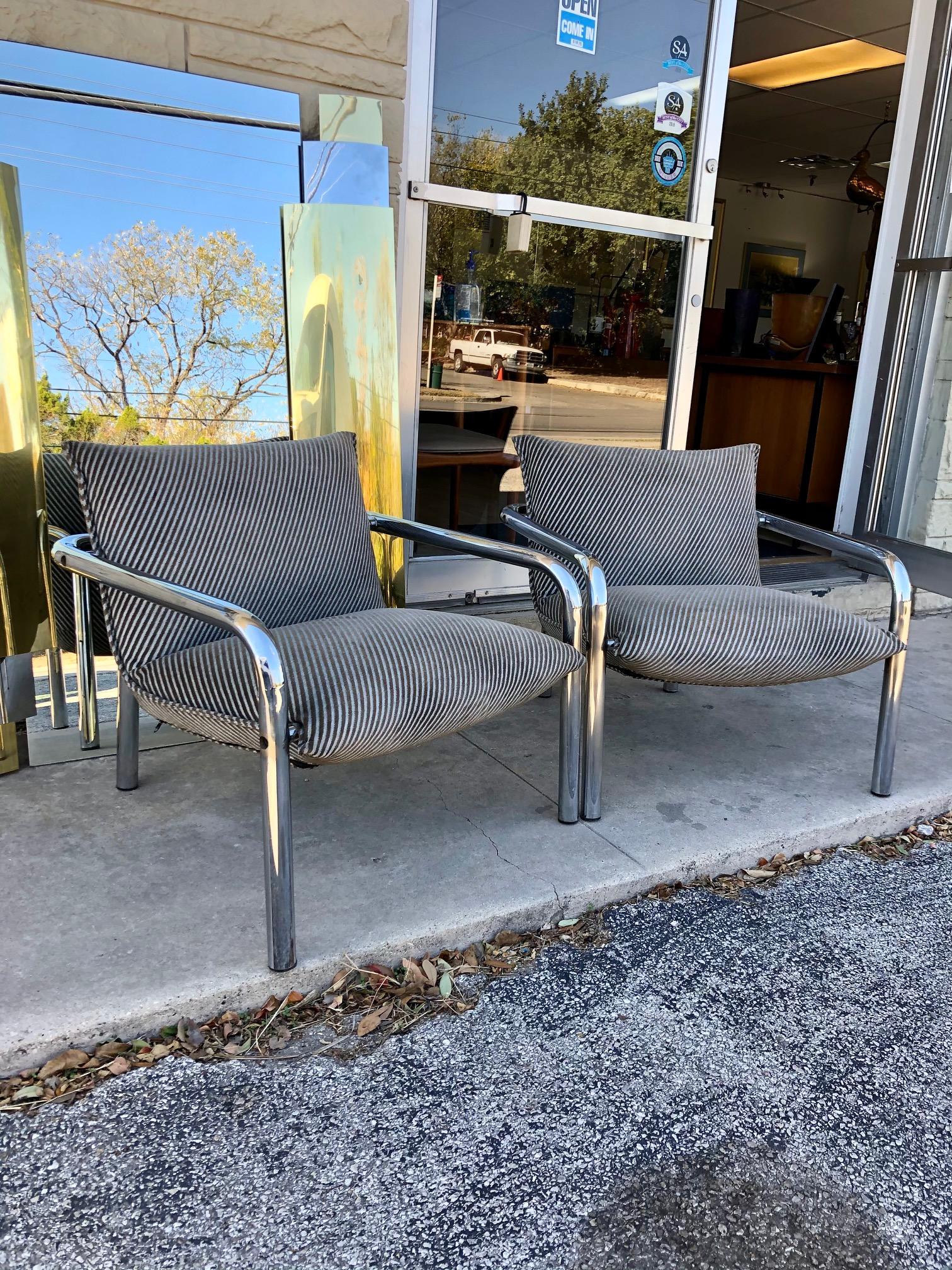 These armchairs are in overall good condition. Chrome frame. Dark grey/light grey stripe upholstery. Function meets style with this comfortable pair. Unknown designer/maker.
circa 1970s.
Dimensions:
27