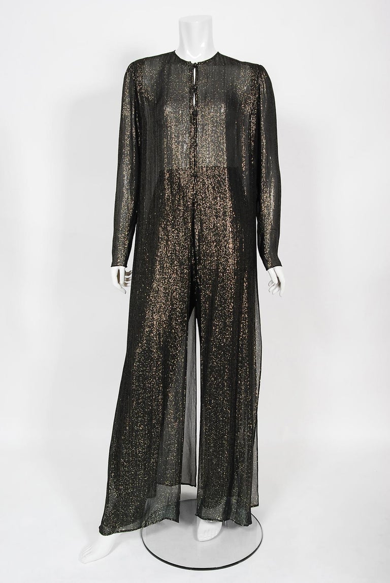 An absolutely gorgeous Jean Patou of Paris semi-sheer metallic silk duster jacket pantsuit dating back to the late 1970's. The detailed construction and meticulous attention to detail are comparable to what you will find in modern couture. Jean
