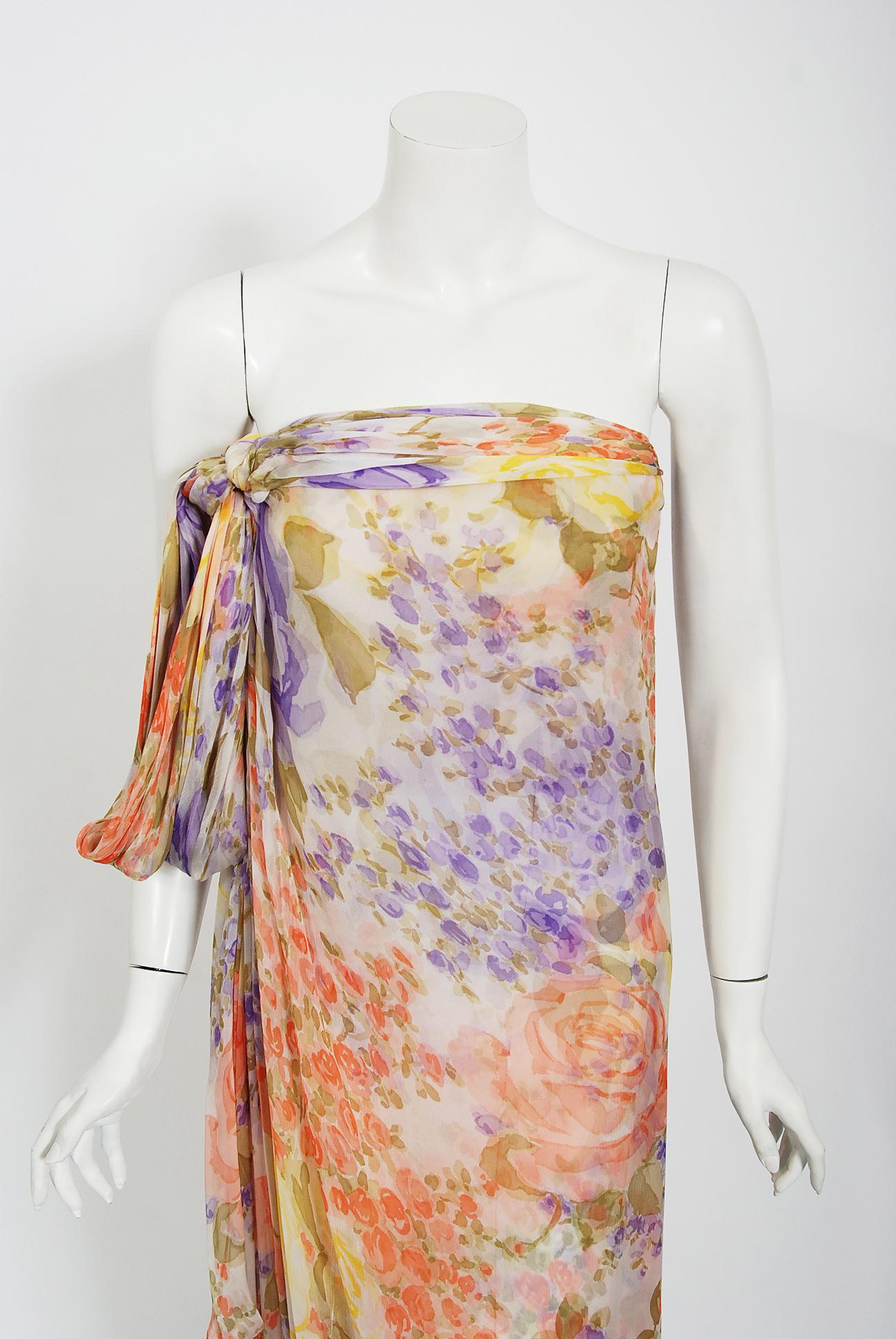 This extremely gorgeous Lanvin Haute Couture rose-garden floral print gown dating back to the late 1970's. I love the beautiful mix of purple, orange and yellow colors. As shown, the elegant bodice wraps over in a Grecian goddess vibe. I love that