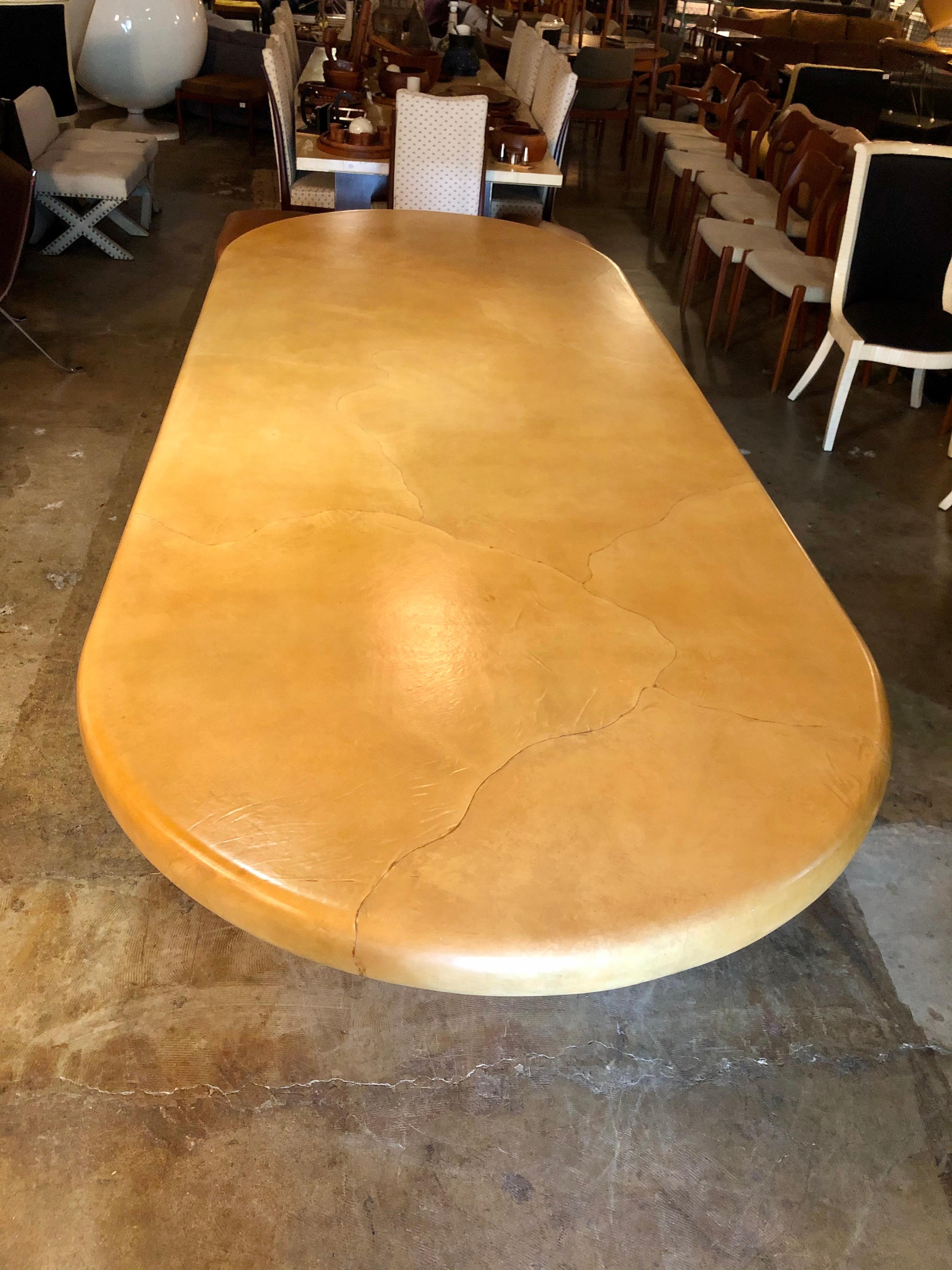 This gorgeous, one-of-a-kind, goatskin top on a chrome base dining table is in overall good condition. Attributed to Karl Springer. There are a few scuffs and discoloration, please see photos for the condition of tabletop and base,
Circa 1970s,