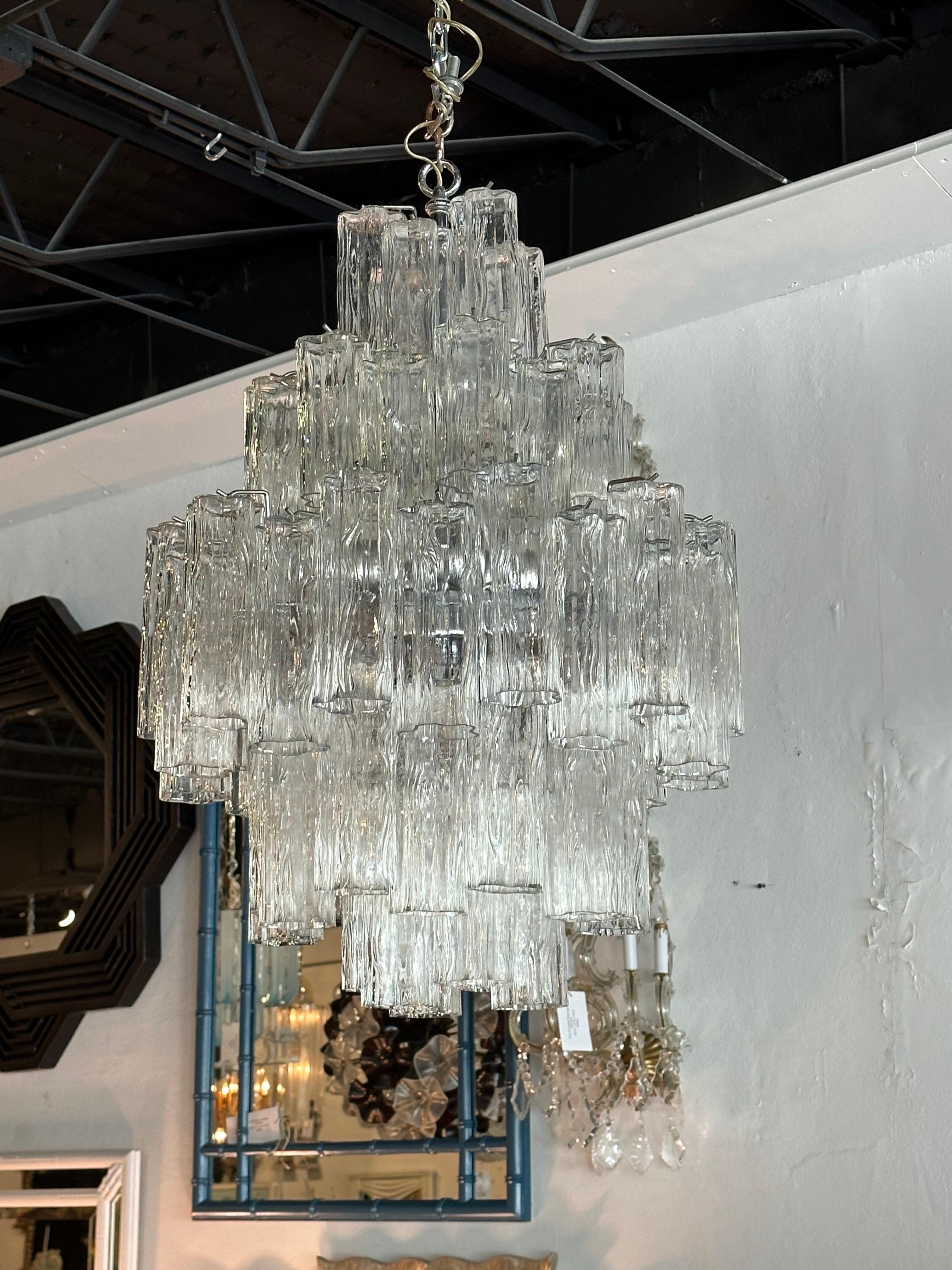 Vintage 1970s Murano Venini glass chandelier. 10 lightbulbs. 5 tiers of glass. 62 pieces of glass. No broken or chipped glass. Chrome cage with ceiling cap. Tested, working order. Actually size of chandelier, which does not include chain length is