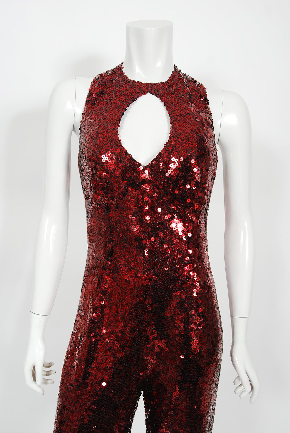A sensational late 1970's red sequin stretch-knit jumpsuit made by Barbara Matera for one of Liza Minnelli's dancers! This rare stage costume comes complete with signed Certificate of Authenticity from Liza Minnelli herself. The designer Barbara