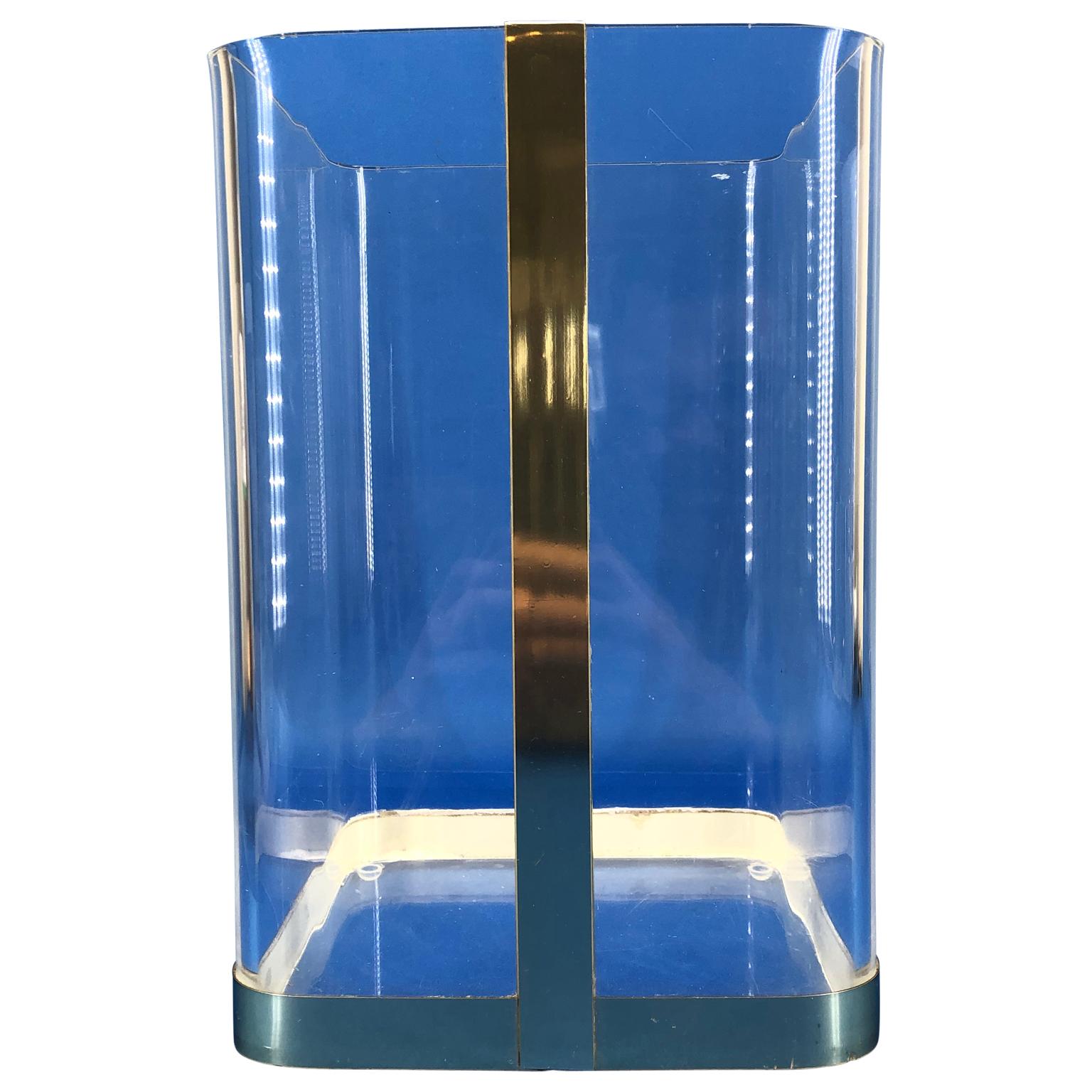 1970s Lucite and brass paper waste basket.

 