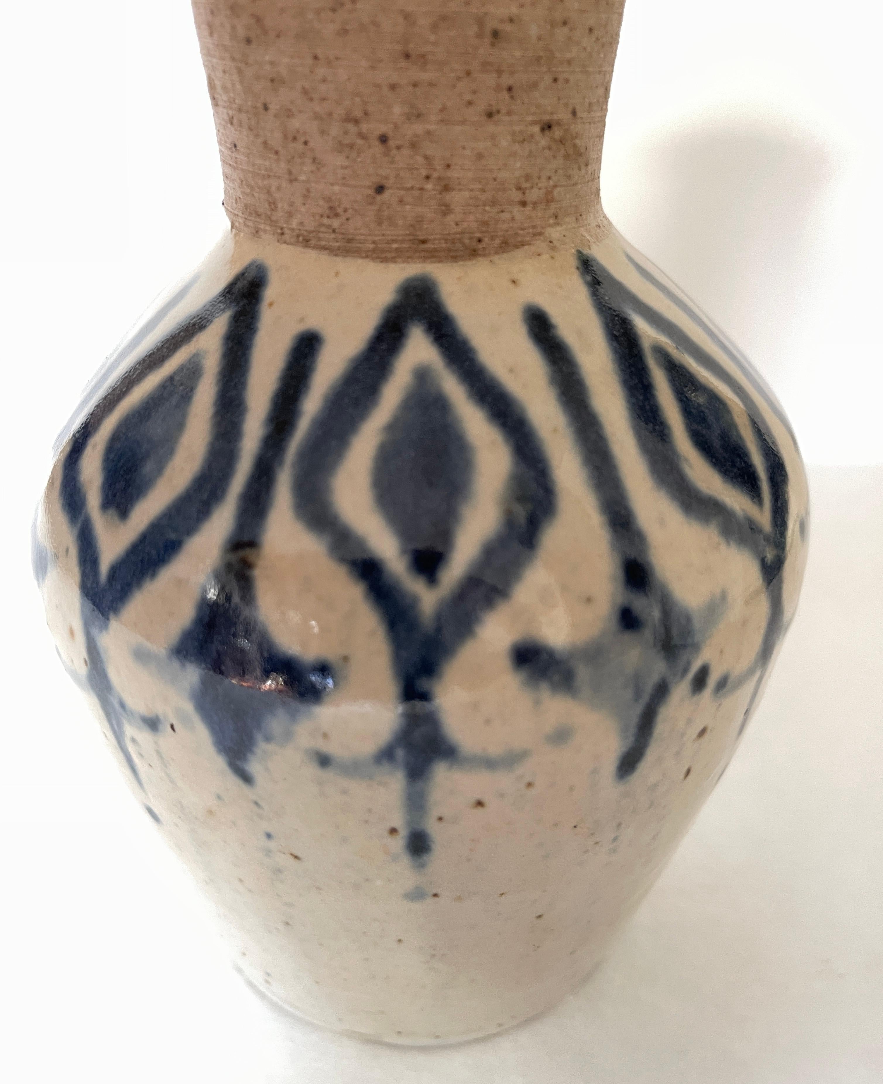 Vintage 1970's studio pottery vase with Moorish design.
Artist hand thrown, decorated and glazed on vase main body, mouth of vase is unglazed. Imperfections in glaze by artist