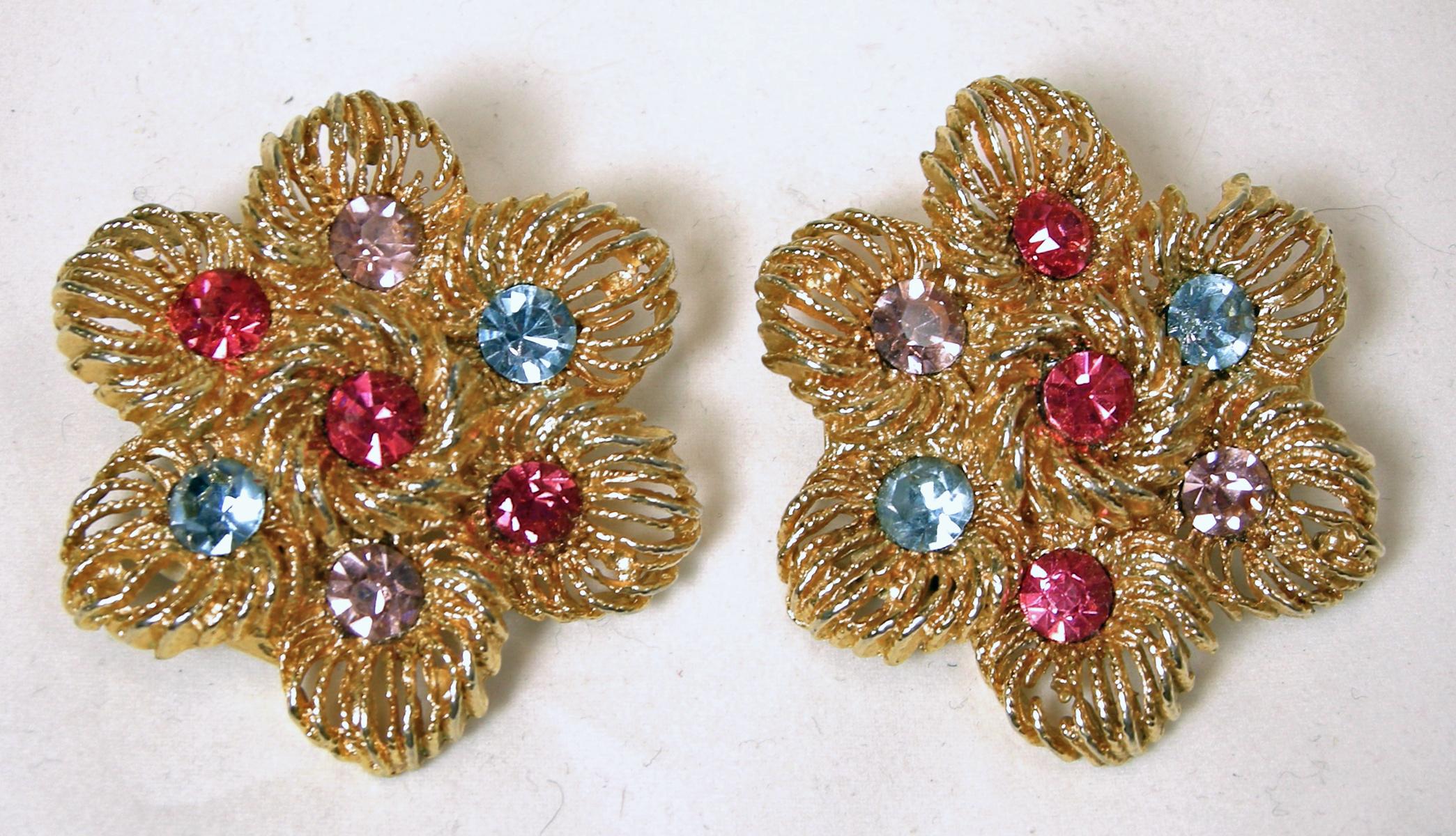 These vintage 1970’s earrings have multi-color crystals in a gold tone setting.  In excellent condition, these clip earrings measure 1-3/4” across/diameter.