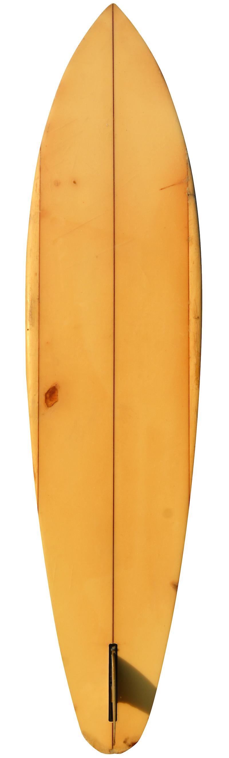 Early to mid-1970s Newport beach brotherhood single fin shortboard shaped by Michael O’Day. Features unique balsawood rails with original tri-color single fin. Newport beach brotherhood logo inscribed with “A Masterpiece for Tom Forkner from Michael