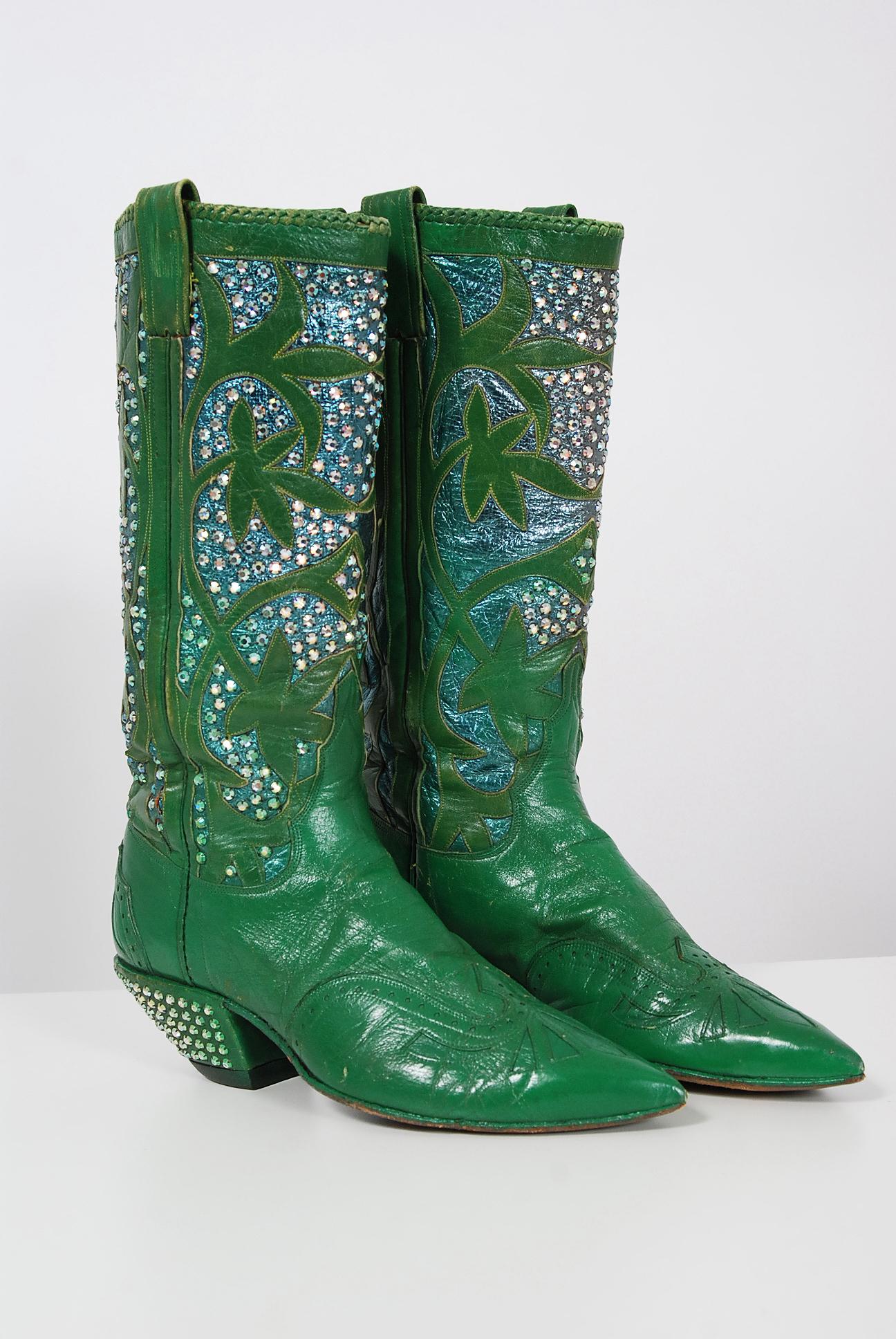 Stunning Nudie's Rodeo Tailor custom-made emerald green leather boots dating back to the early 1970's. Nudie Cohn was one of the great makers of Hollywood western-style garments. Nudie began making cowboy attire in 1940, doing orders for clients