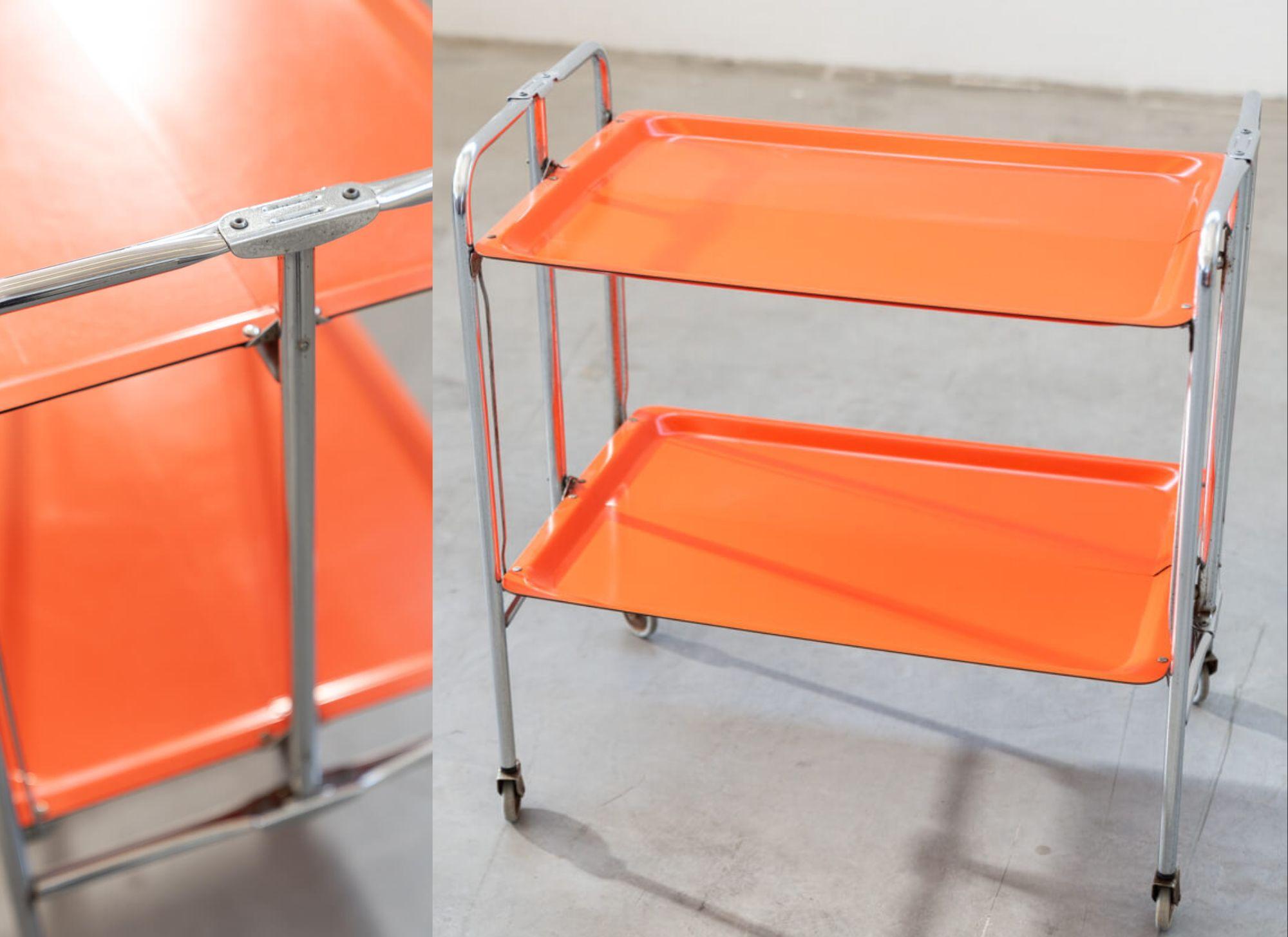 Vintage 1970s Orange Folding Bar Cart – A Retro Chic Statement Piece

Add a pop of vibrant retro style to your home with this eye-catching folding bar cart from the 1970s. This piece perfectly captures the playful yet functional design ethos of the