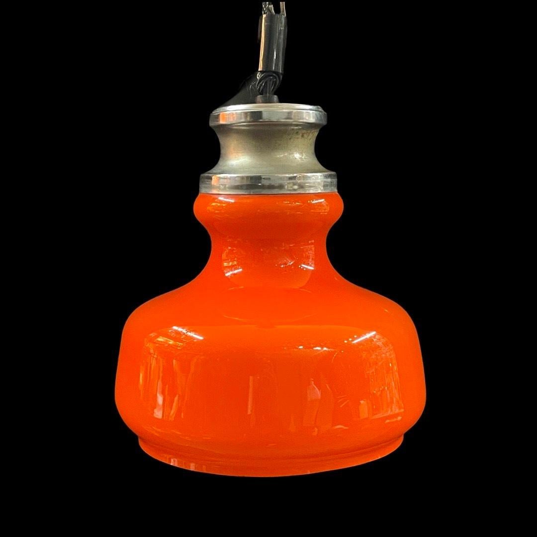 Transport yourself back to the iconic era of the 1960s and 1970s with this vintage Orange Rise & Fall Pendant Light—an absolute classic of its time.

This stunning piece exemplifies the era's aesthetic with its eye-catching design and par excellence