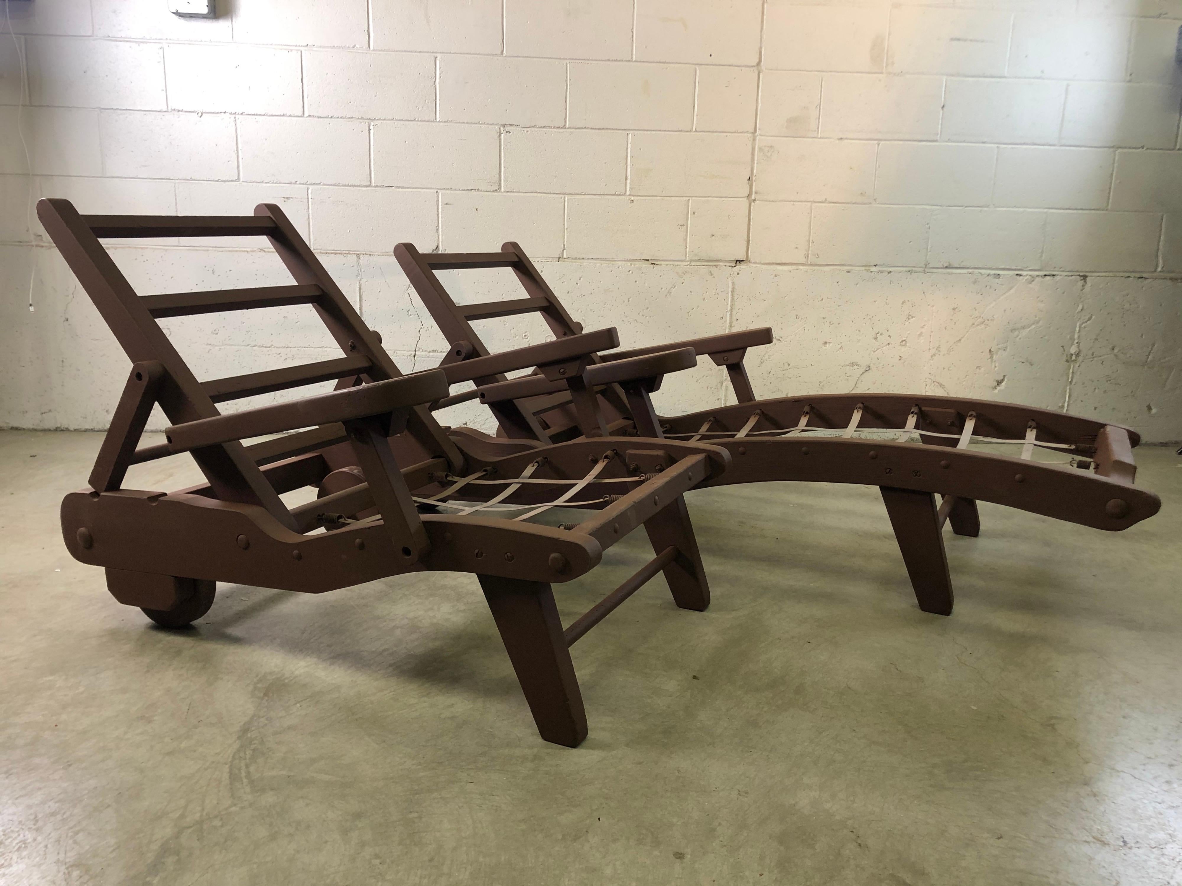Vintage 1970s pair of outdoor wood chaise lounge and chair set. Both have wheels to roll and are newly repainted. Great sturdy wood outdoor door furniture. Cushions are not included. Metal webbing is tight. Back rests are painted shut. No marks.