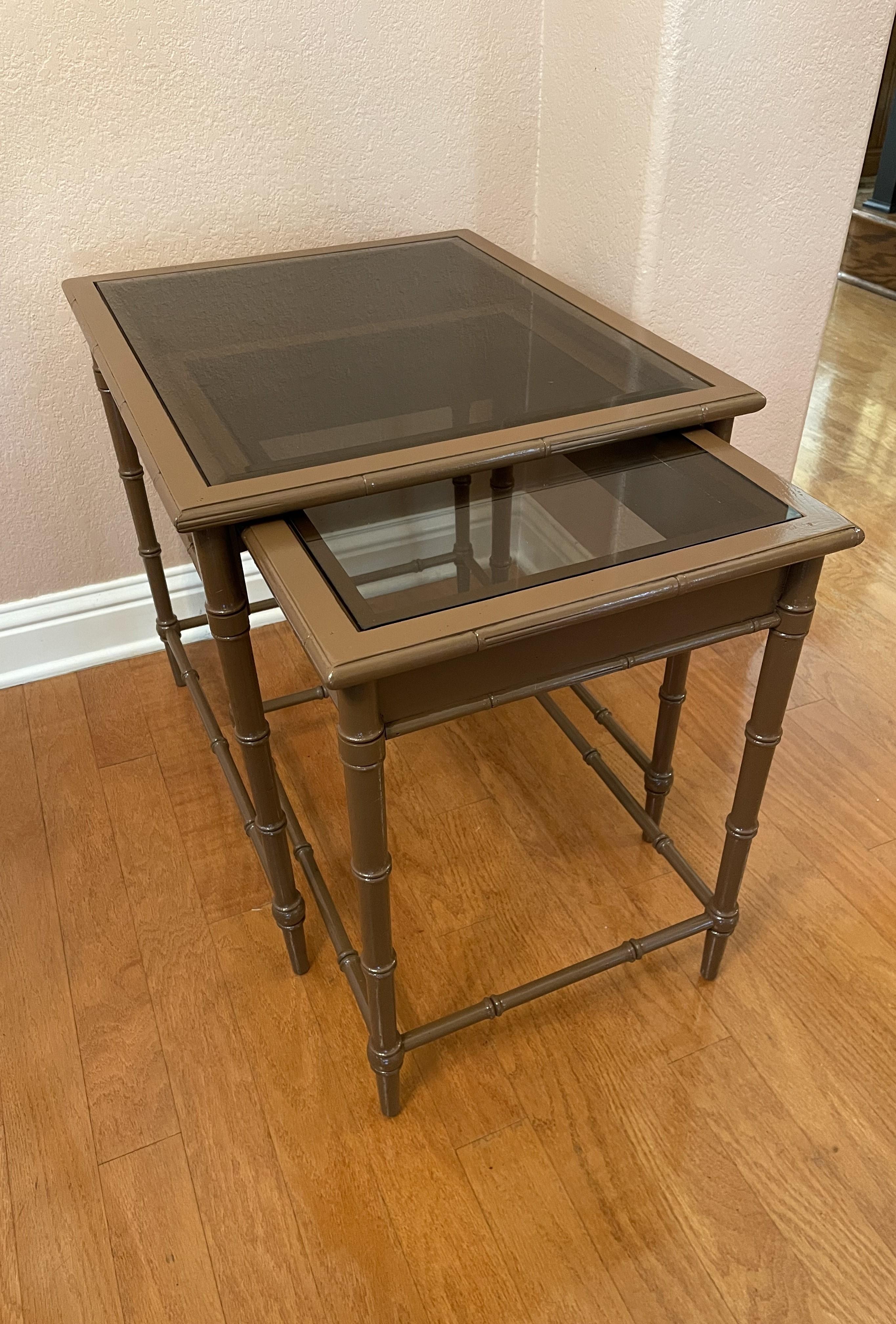 This two-piece nesting table is a versatile neutral accent table. For the most part it will work anywhere, from extra surface area in a study or home office to a sofa-side table. It's straight from the 1970s -- with the smokey-glass tops serving as