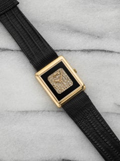Piaget Protocole 9150 de los años 70, de oro amarillo de 18 quilates, con esfera de ónix y pavé de diamantes, cuerda manual, 23 mm