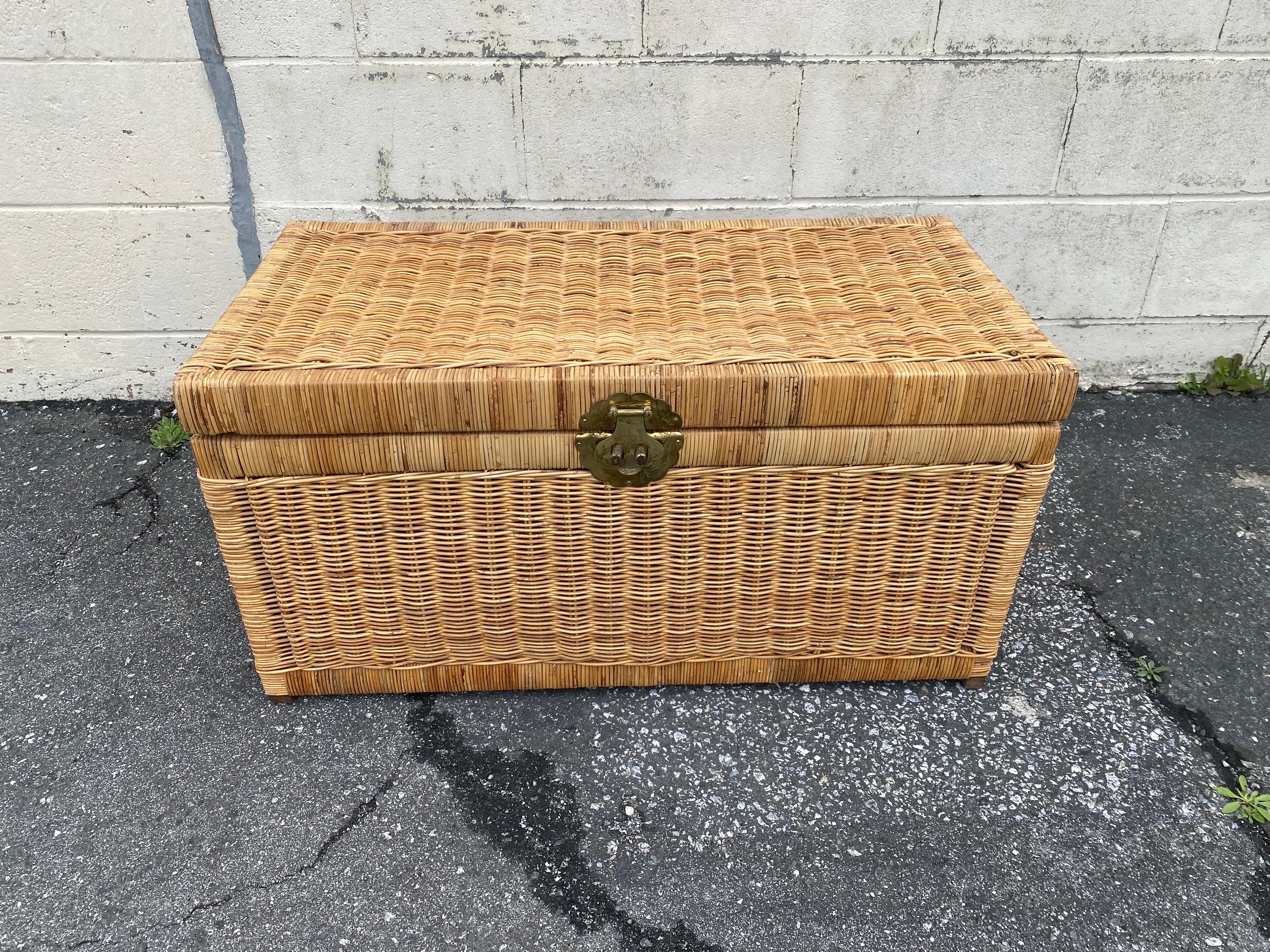 Beautiful vintage handwoven wicker rattan storage chest for blankets or the store anything you want to help save space and de-clutter. Made in the middle of the twentieth century this chest comes complete with brass hardware, adorned with birds and