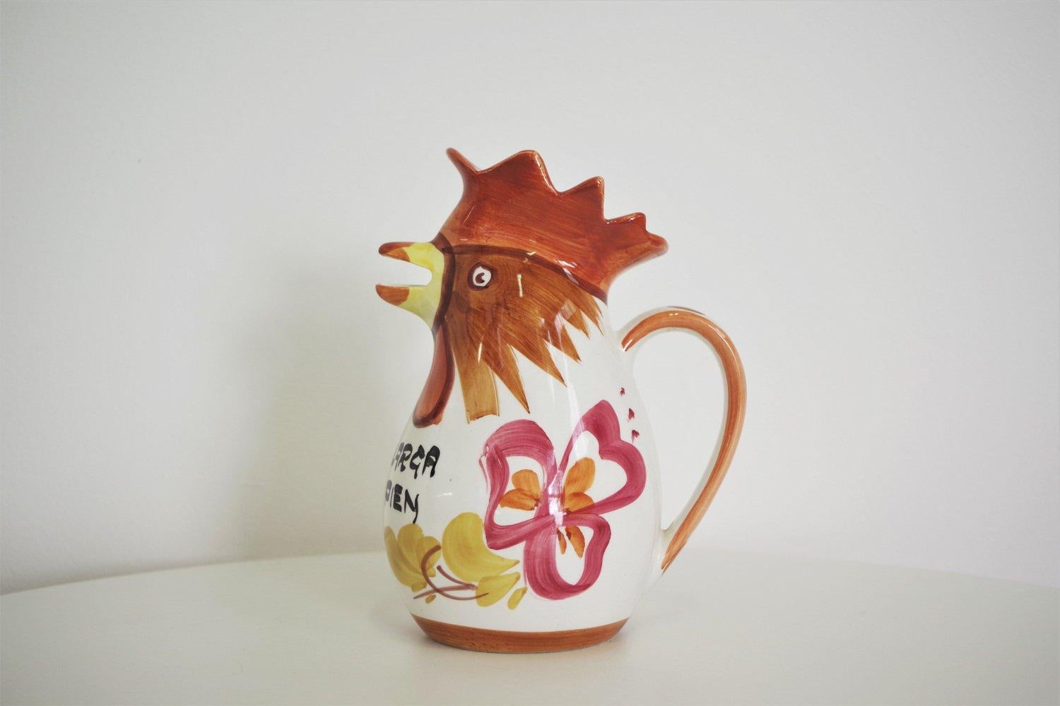 Vintage 1970s Rooster-Shaped Ceramic Jug from Bassano - Italian Artisan Craftsmanship

Description:
Bring a touch of whimsical Italian artistry to your table with this charming rooster-shaped ceramic jug from Bassano, dating back to the 1970s. This